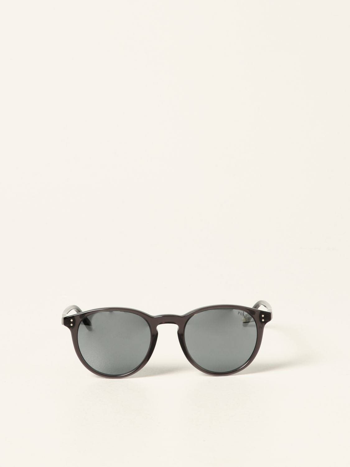 glasses 桌布 壁紙 — 經典圓形太陽眼鏡，深灰色鏡片和玳瑁框，置於純色米白背景中央。