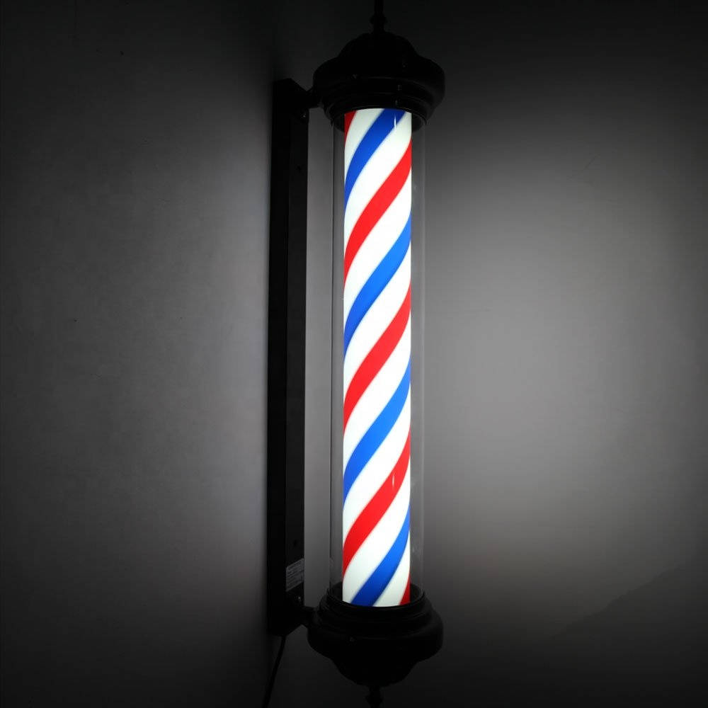 Barber 桌布 壁紙 — 經典理髮柱，帶有紅、白、藍斜條紋，在深灰色牆壁上發光。