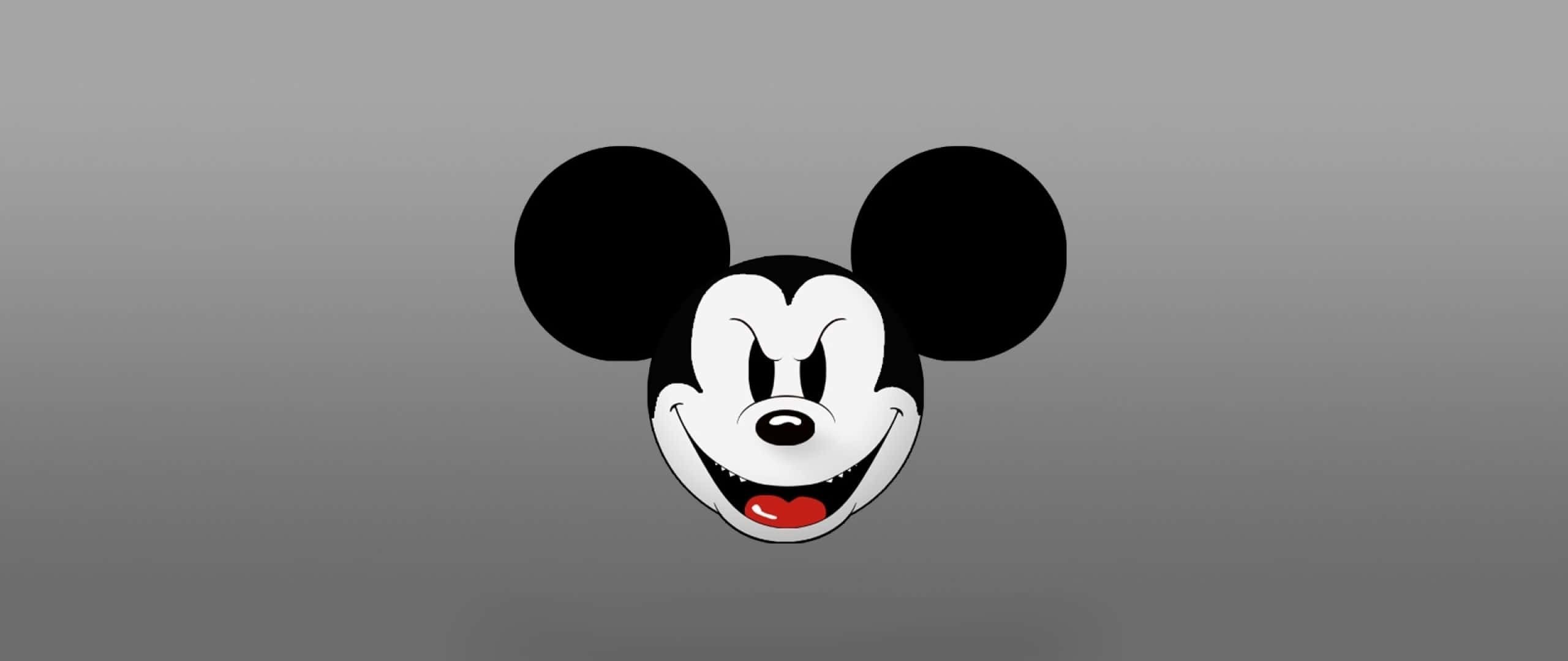 Mickey Mouse Ears 桌布 壁紙 — 經典米奇老鼠頭部，大耳朵和寬闊笑容，背景為平滑灰色漸變。