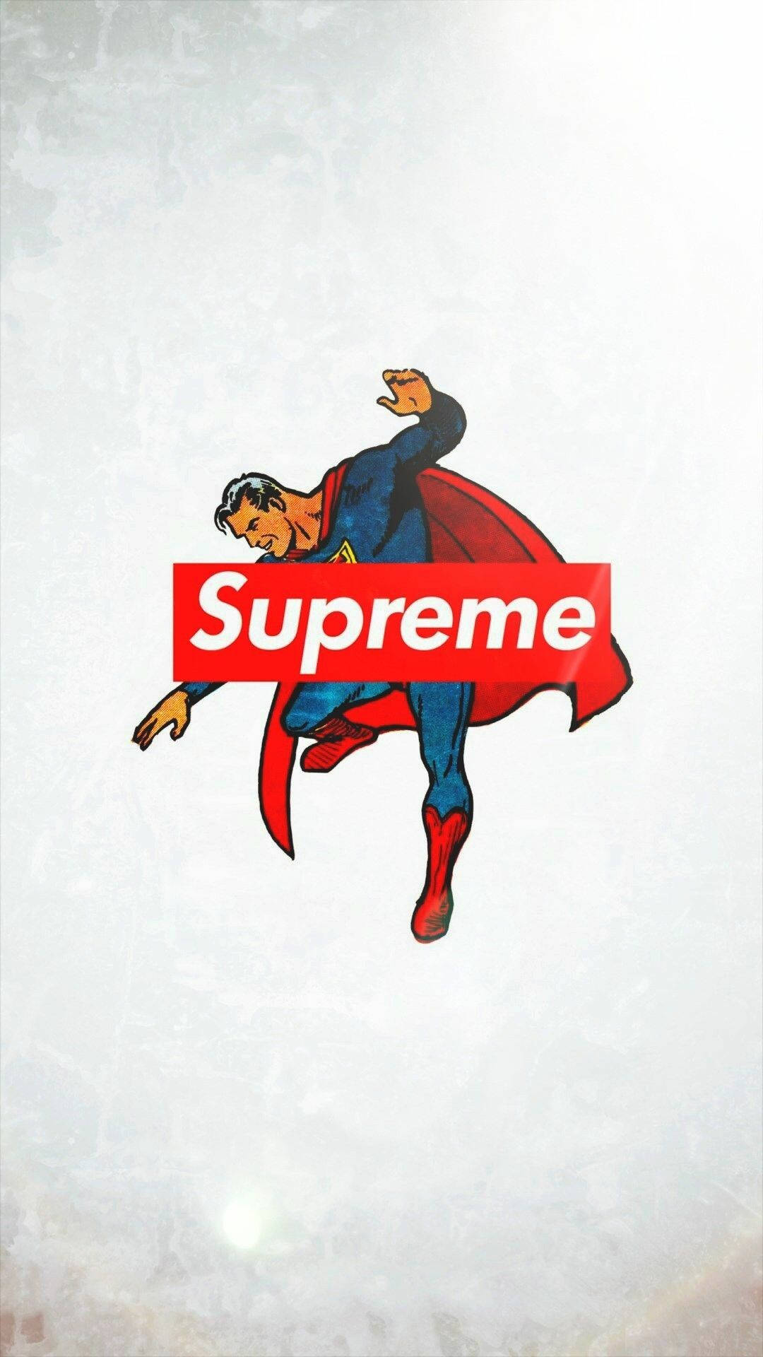 supreme 桌布 壁紙 — 經典超人動態跳躍在帶有紋理的白色背景上，越過一個大膽的紅色Supreme標誌。