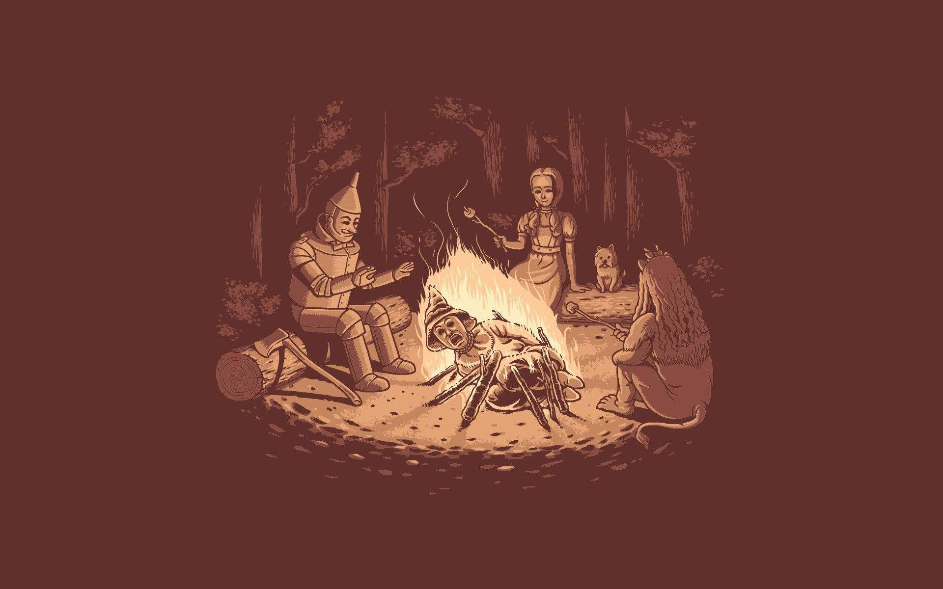 wizard 桌布 壁紙 — 《綠野仙蹤》中的四個標誌性角色聚集在森林的營火旁，在溫暖的光芒下烤棉花糖。