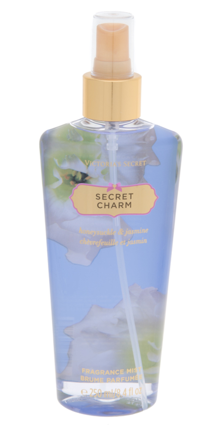 維多利亞的秘密 桌布 壁紙 — 維多利亞的秘密 Secret Charm 香水噴霧的透明藍色瓶子，帶有花卉設計和金色噴嘴。
