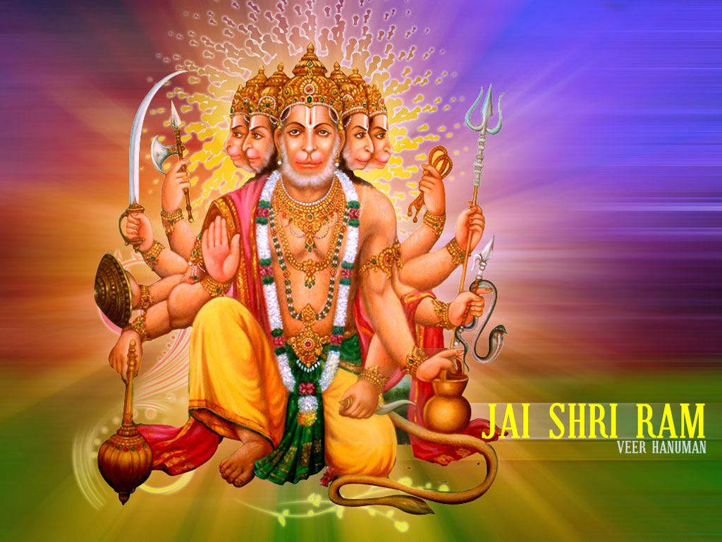 angry hanuman 桌布 壁紙 — 維爾·哈努曼威嚴地坐著，多隻手臂持有武器和象徵，背景是絢麗多彩的光芒。