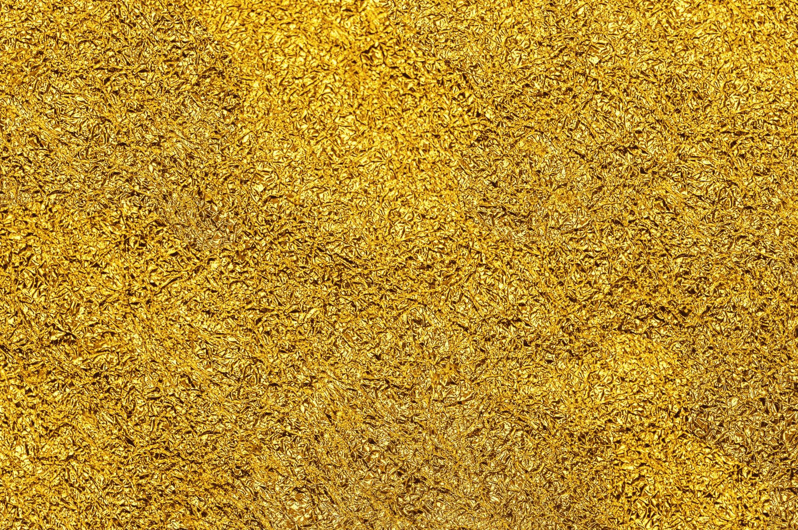 Golden 桌布 壁紙 — 緊密排列的金棕色乾燥植物纖維特寫，形成豐富的紋理表面。