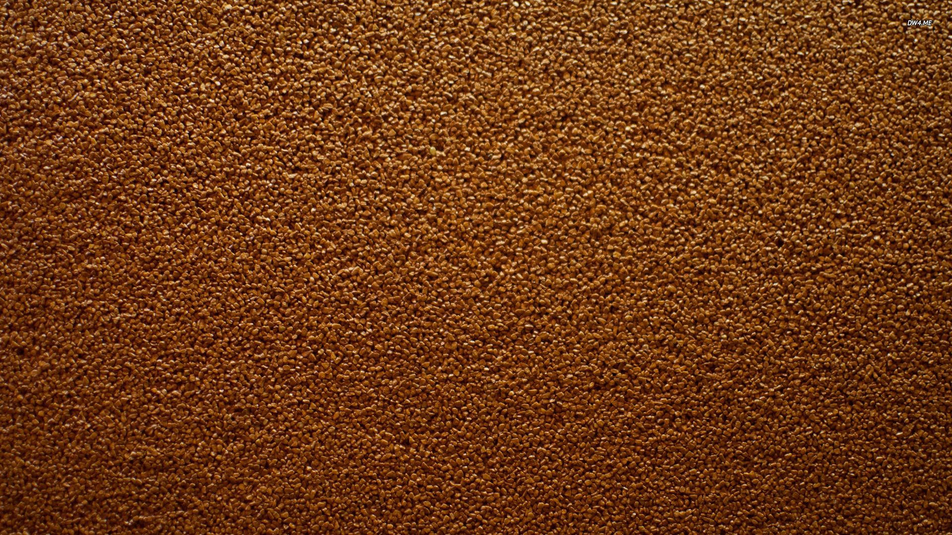 Brown 桌布 壁紙 — 緊密棕色顆粒質感的特寫，類似壓碎的咖啡豆或土壤。