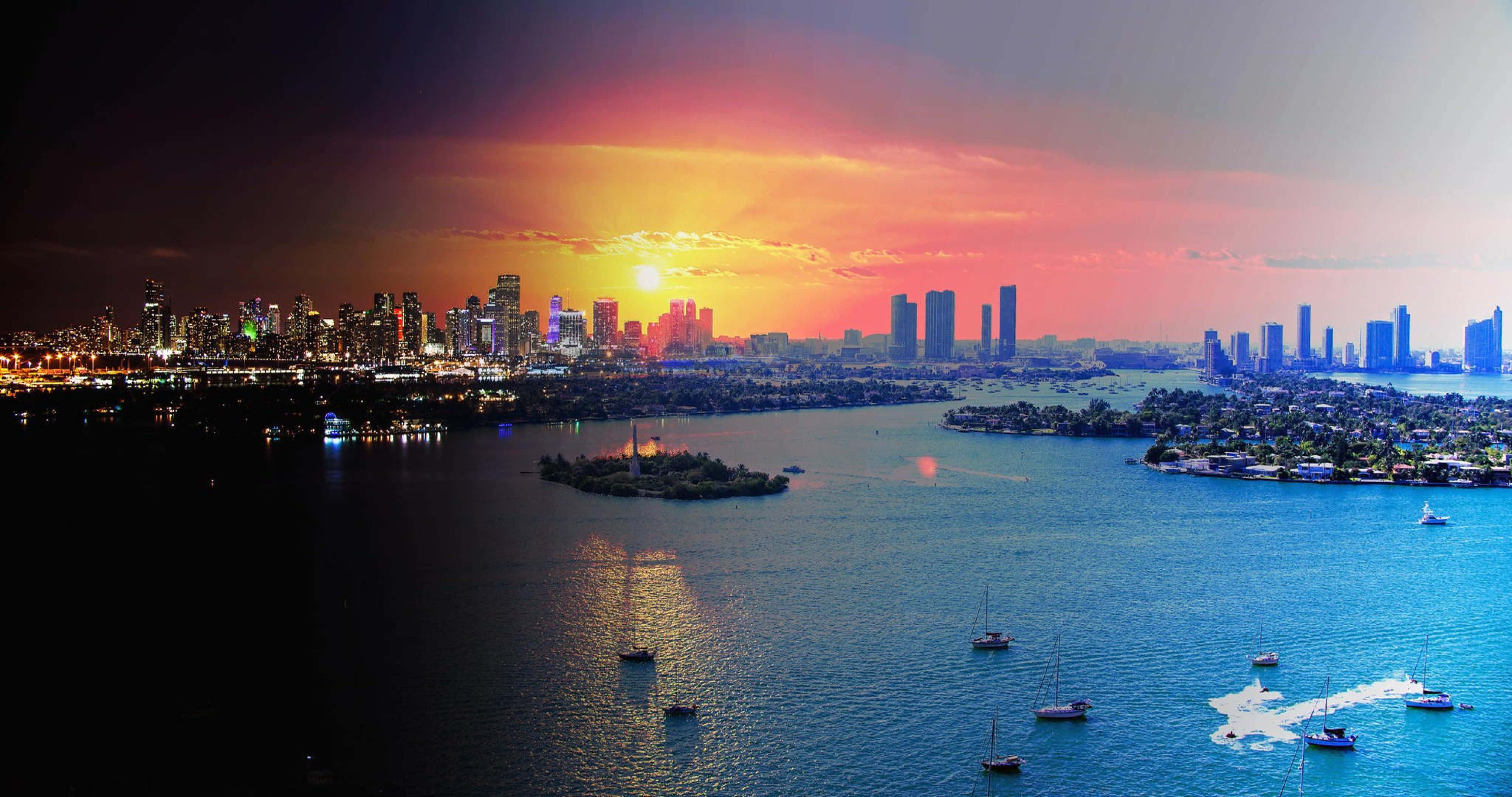 Miami 4K 桌布 壁紙 — 繁華城市天際線上充滿活力的日落，倒映在點綴著帆船和快艇的平靜水面上。