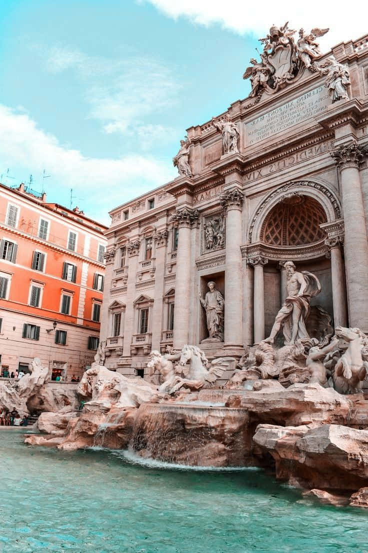 Rome 桌布 壁紙 — 羅馬一座宏偉的巴洛克噴泉，擁有大理石雕像和流動的水，在明亮的藍天下。