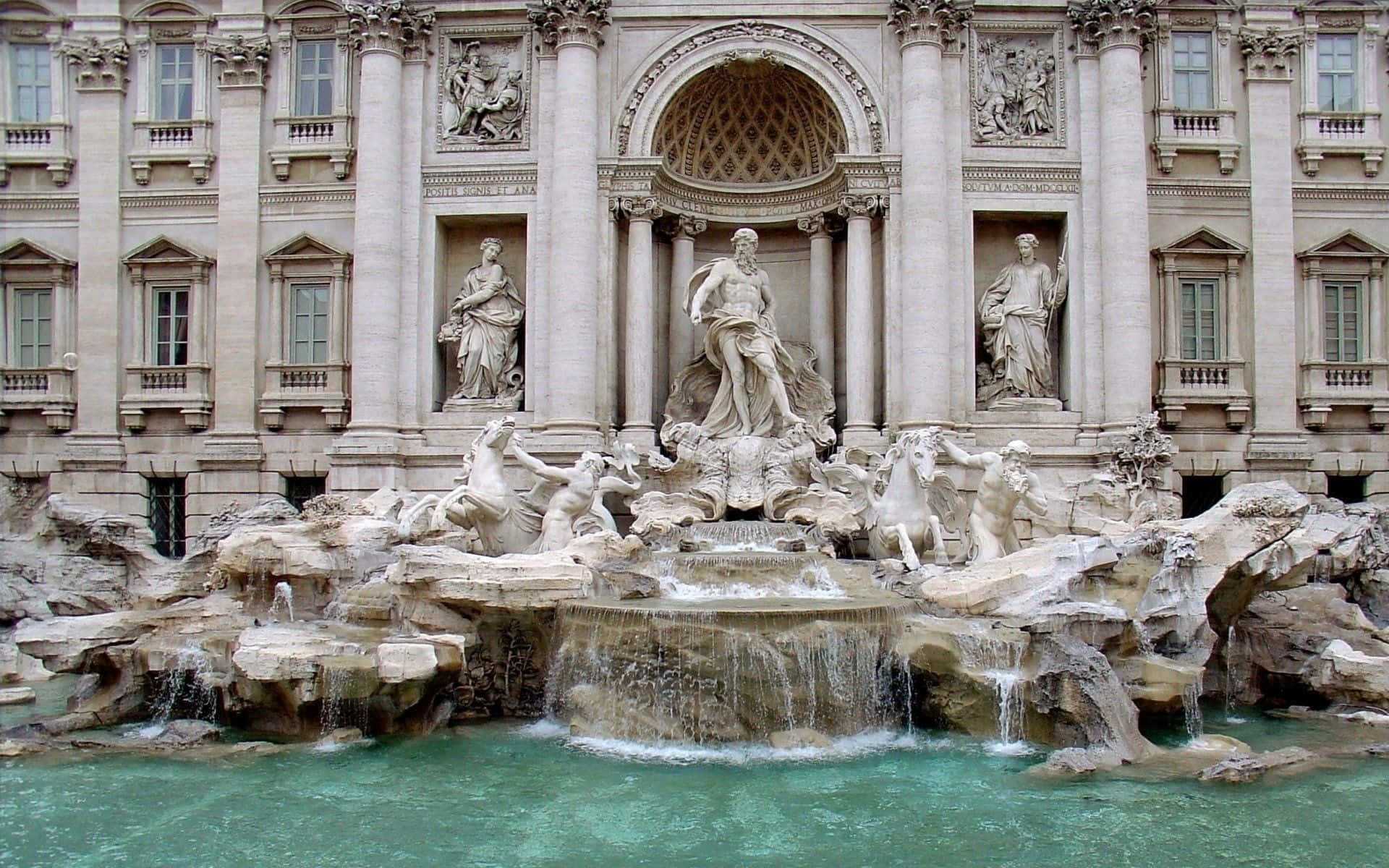 Rome 桌布 壁紙 — 羅馬的特雷維噴泉以華麗的大理石雕塑和層疊流水為特色，背景是宏偉的新古典主義建築立面。