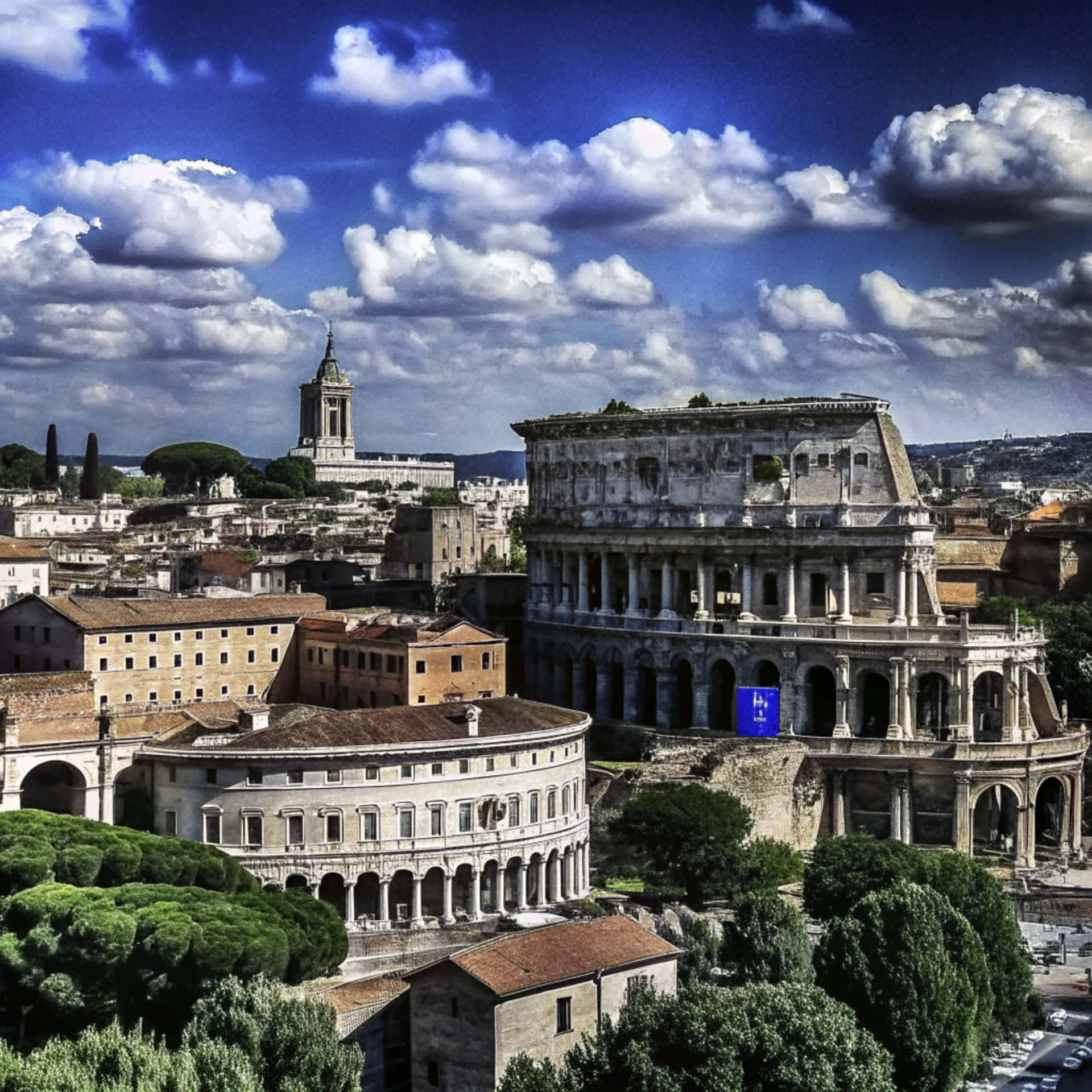 Colosseum 壁紙 — 羅馬競技場在羅馬雄偉地矗立，頭頂是點綴著蓬鬆白雲的鮮豔藍天。