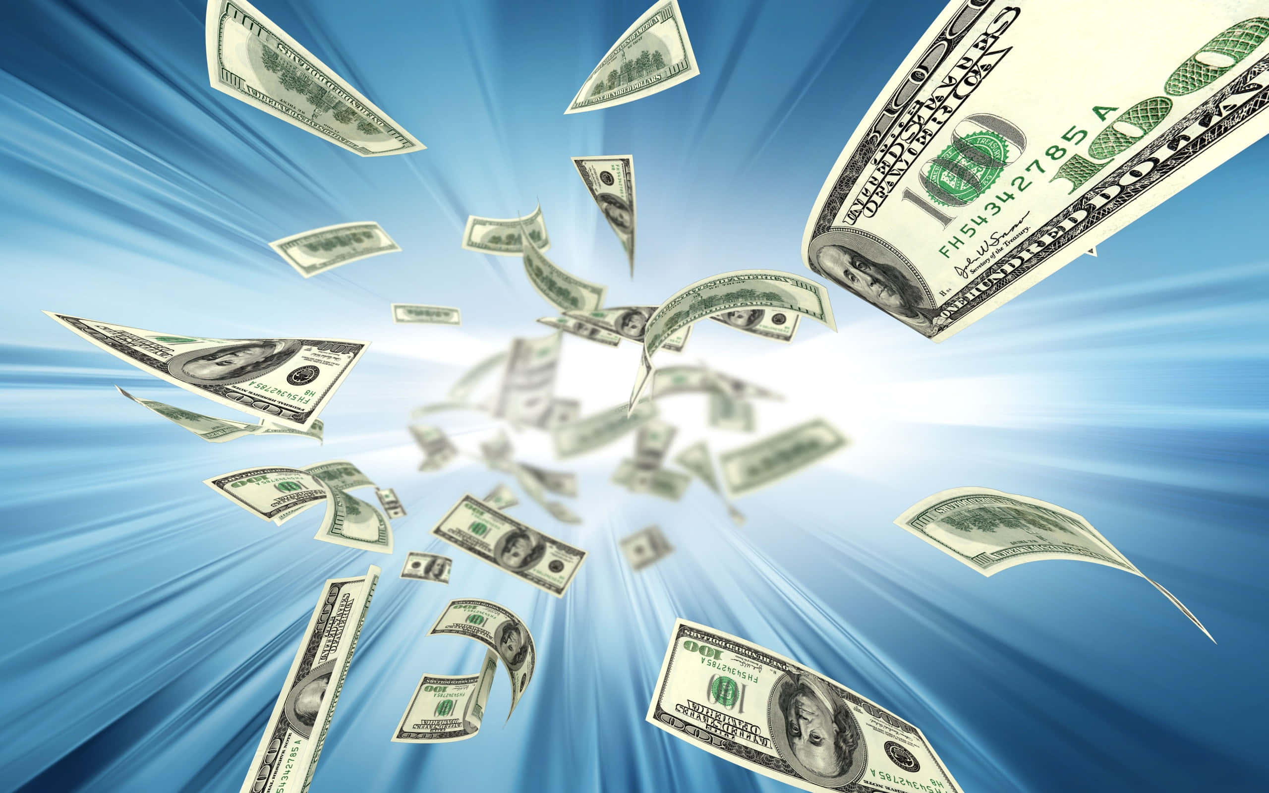 dollar 桌布 壁紙 — 美元鈔票從明亮的中心向外爆炸，在燦爛的藍天背景下呈現動態運動模糊效果。