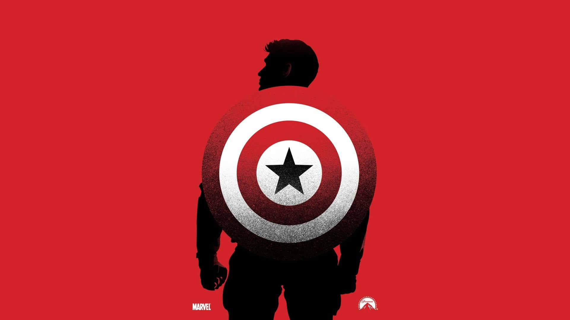 Captain America Logo 桌布 壁紙 — 美國隊長剪影，手持標誌性盾牌，背景為大膽的紅色。