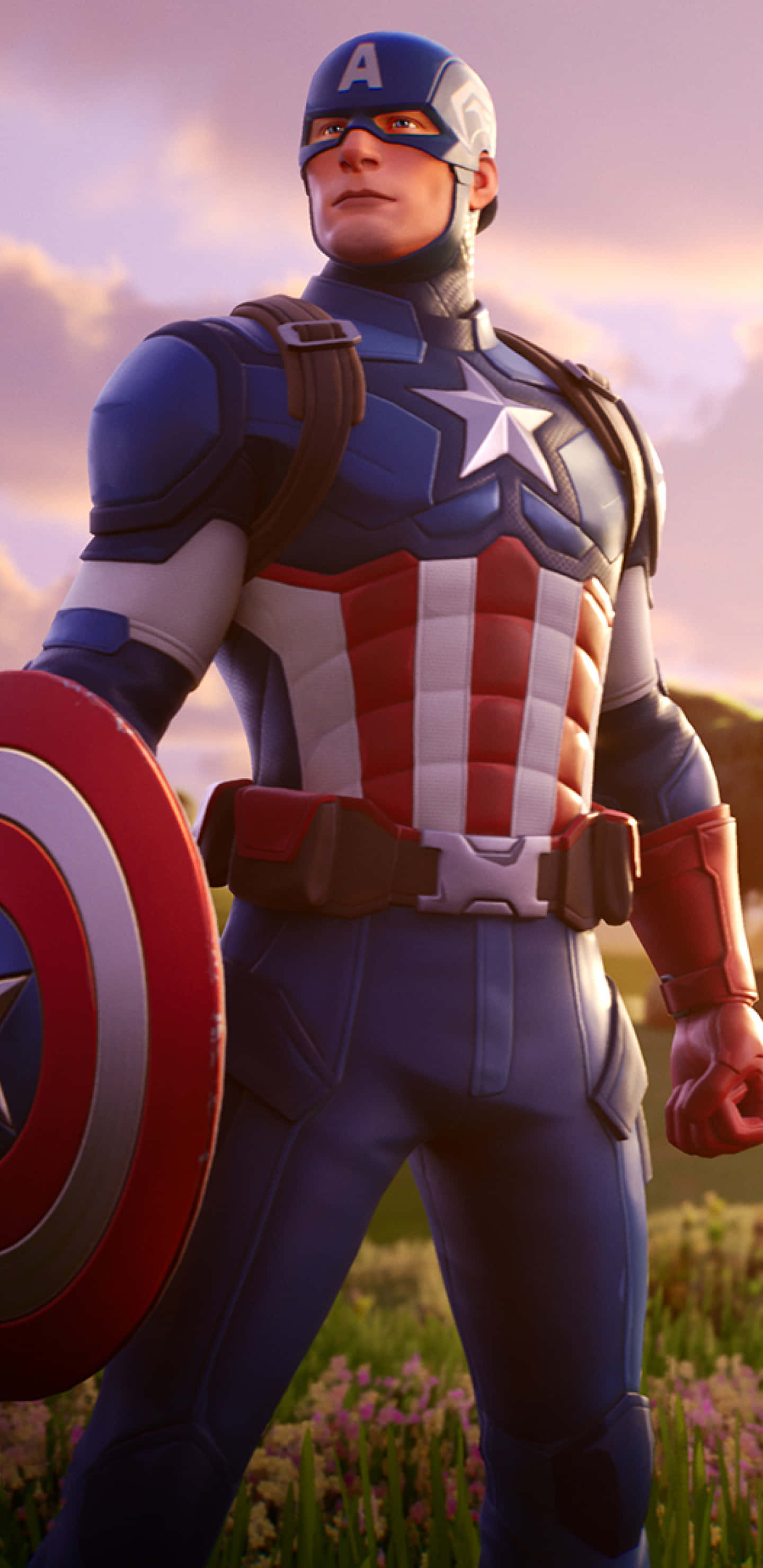 Pixel 3xl Captain America 桌布 壁紙 — 美國隊長在夕陽下的紫色花田中英雄地站立，手持他標誌性的盾牌。