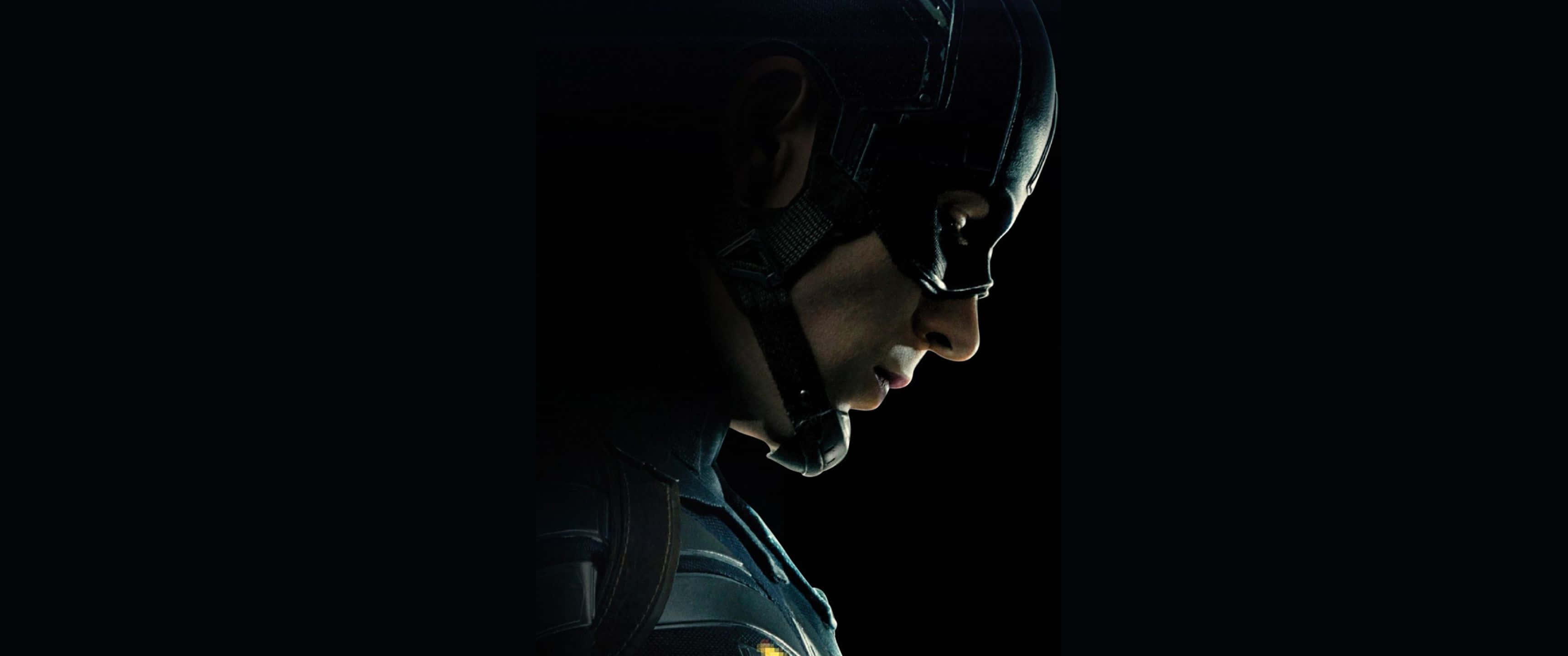 Marvel Movie 桌布 壁紙 — 美國隊長在昏暗燈光下專注表情的戲劇性側面輪廓。