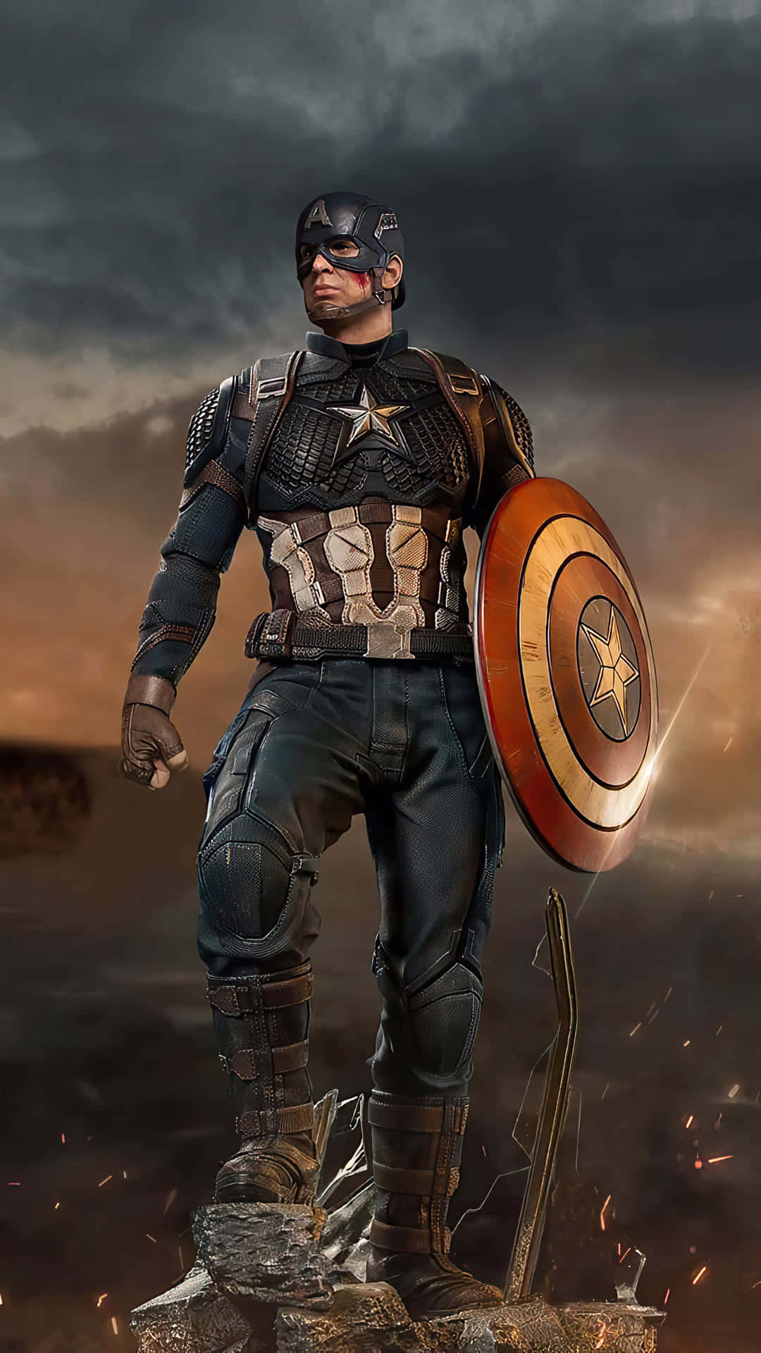 Marvel Captain America 桌布 壁紙 — 美國隊長在破碎的石頭上堅定地站著，在暴風雨的暮色天空下舉著他標誌性的盾牌。
