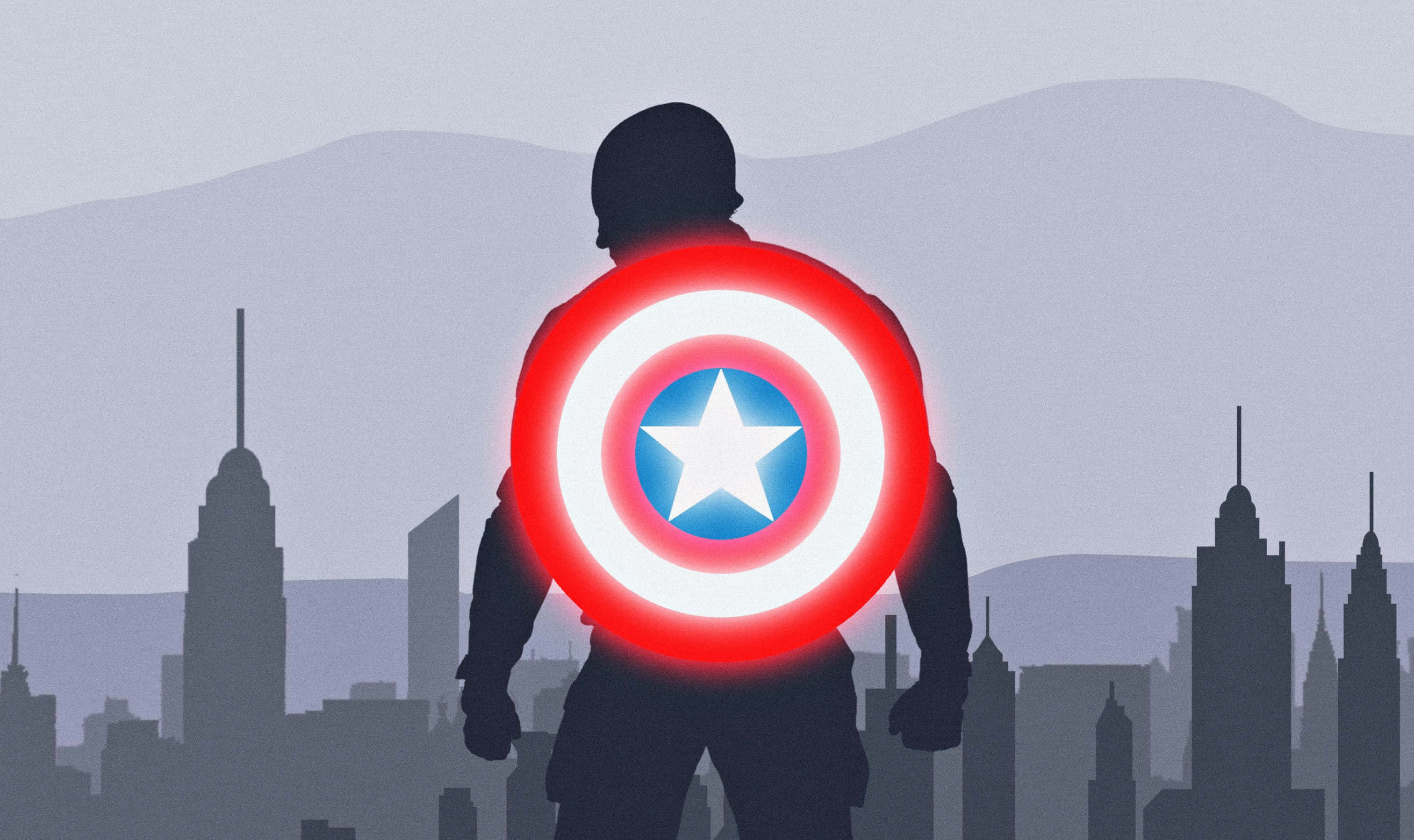 Best Captain America 桌布 壁紙 — 美國隊長的剪影，手持發光盾牌，面向有山脈的朦朧城市天際線。