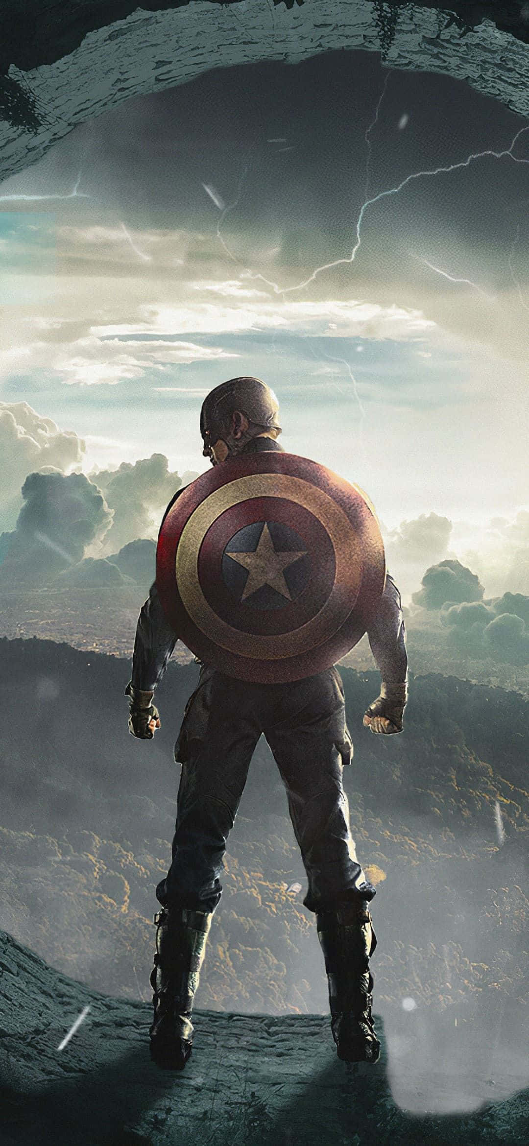 Captain America Movie 桌布 壁紙 — 美國隊長站在懸崖頂上，手持盾牌，閃電劃過暴風雨的天空，下方是廣闊的風景。