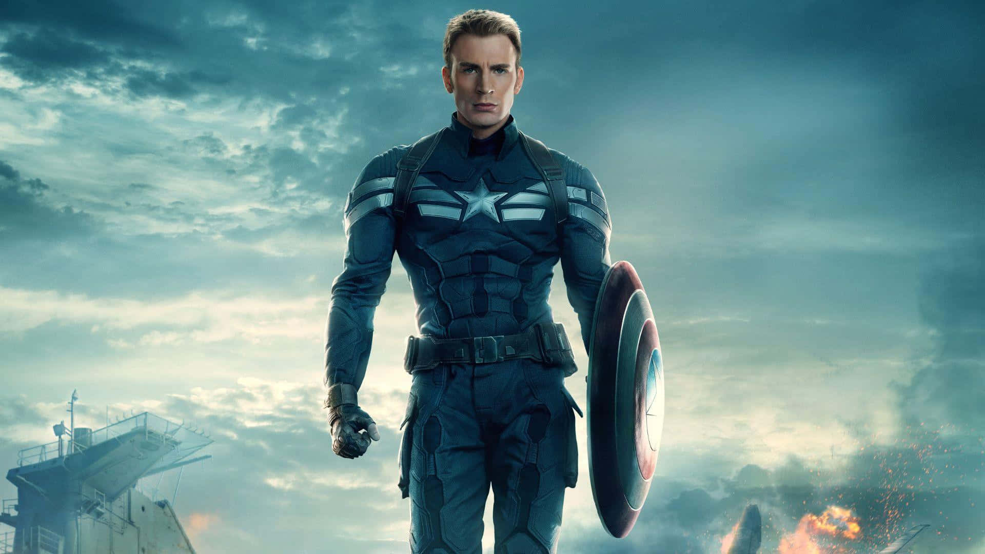 Captain America Desktop 桌布 壁紙 — 美國隊長身穿藍色戰衣，堅定地站立，手持標誌性盾牌，背景是暴風雨般的戰場天空。