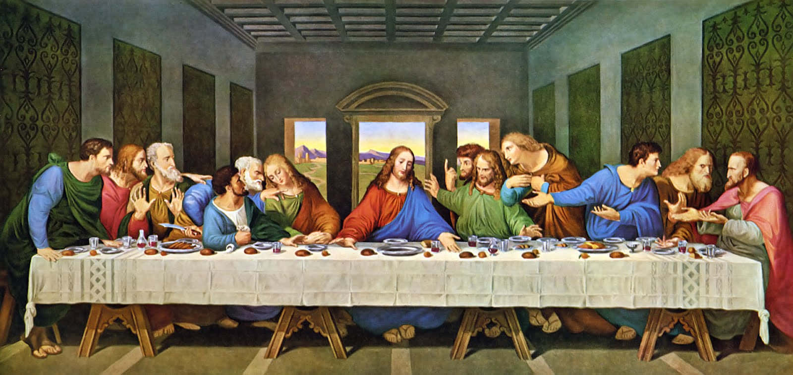 The Last Supper 桌布 壁紙 — 耶穌和祂的門徒在最後的晚餐期間，聚集在一個石牆房間的長桌旁，表情和手勢充滿戲劇性。