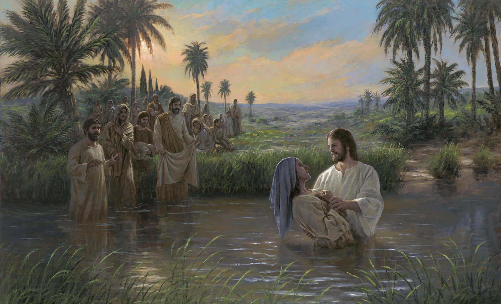 Baptism 桌布 壁紙 — 耶穌在淺河中溫柔地抱著一位女子，旁觀者在棕櫚樹間的金色夕陽下觀看。