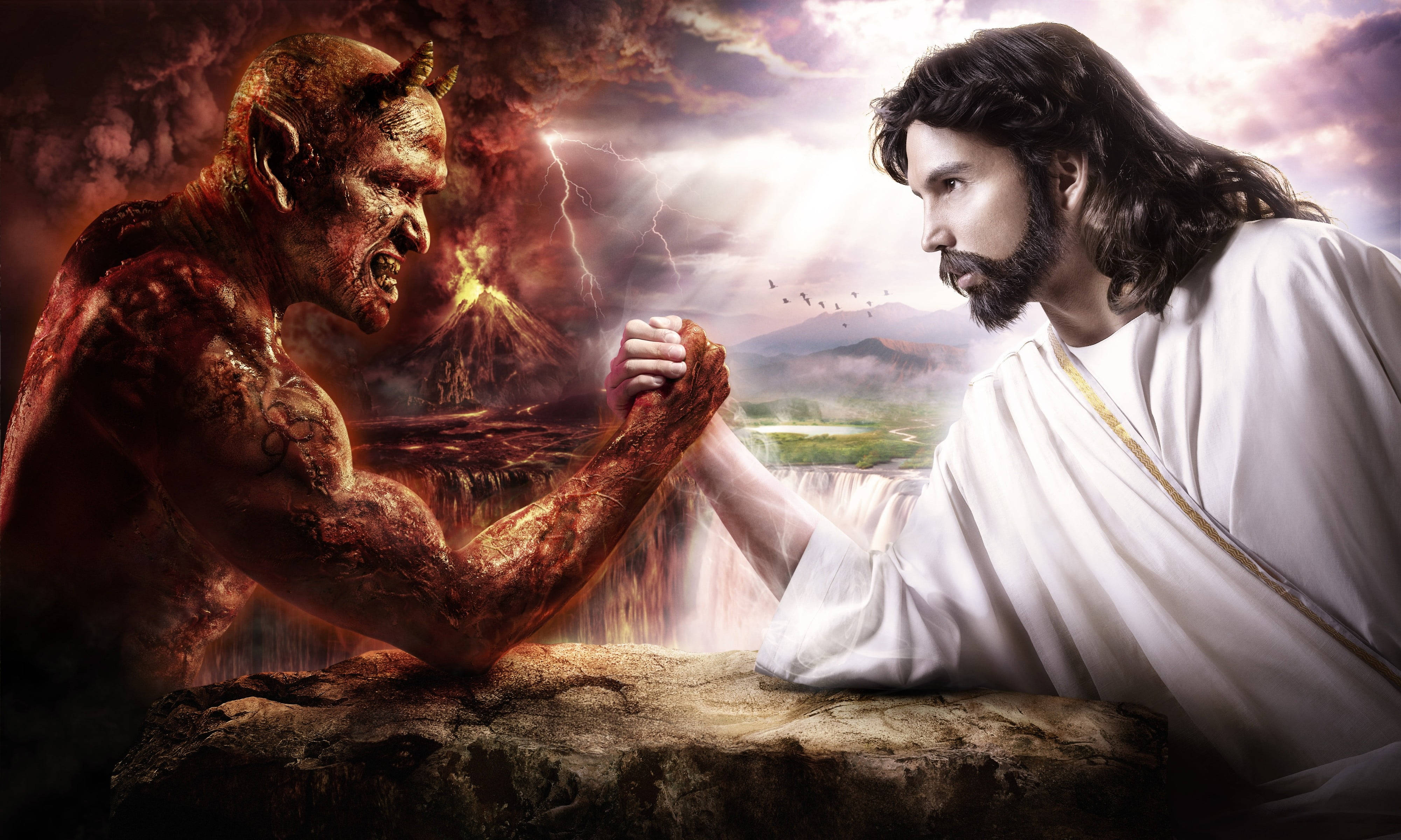Christ 桌布 壁紙 — 耶穌與魔鬼在岩石懸崖上掰手腕，一邊是熾熱的火山，另一邊是寧靜神聖的景色。
