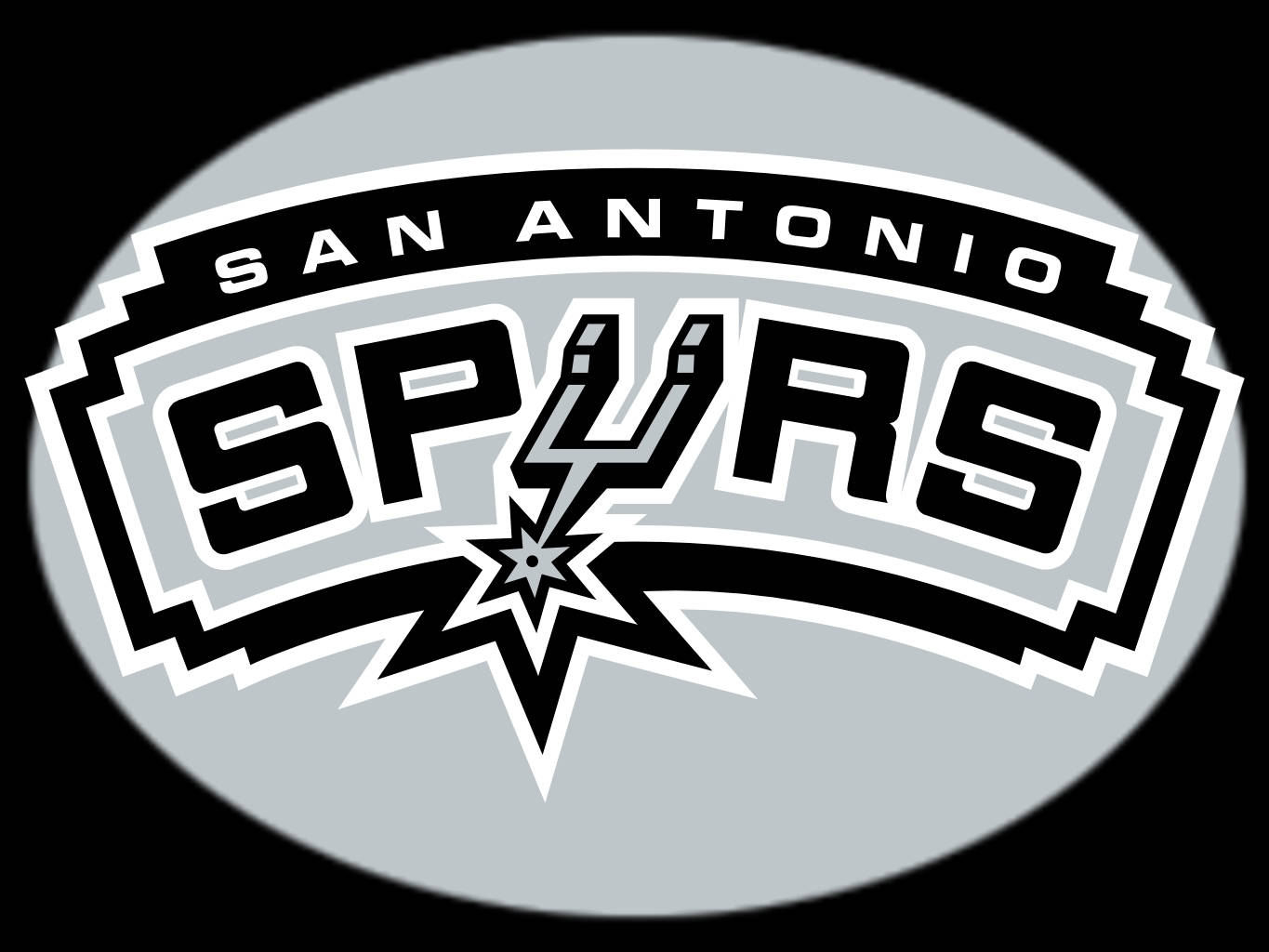 Spurs 桌布 壁紙 — 聖安東尼奧馬刺隊標誌，以黑、白、灰色呈現，置於黑色背景上，並帶有星爆設計。