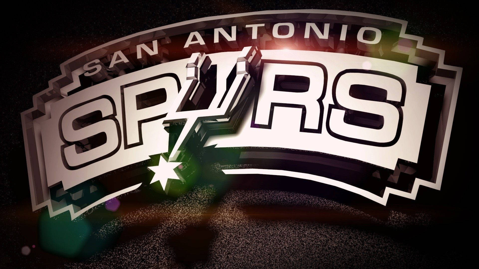 Spurs 桌布 壁紙 — 聖安東尼奧馬刺隊標誌在深色紋理背景上閃耀金屬光澤和星爆光效。