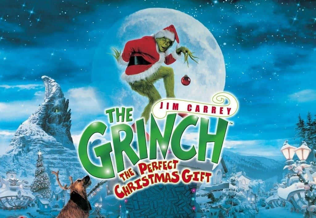 Christmas Movie 桌布 壁紙 — 聖誕老人裝扮的鬼靈精在滿月前跳躍，下方是白雪覆蓋的胡維爾村莊，背景是星空。