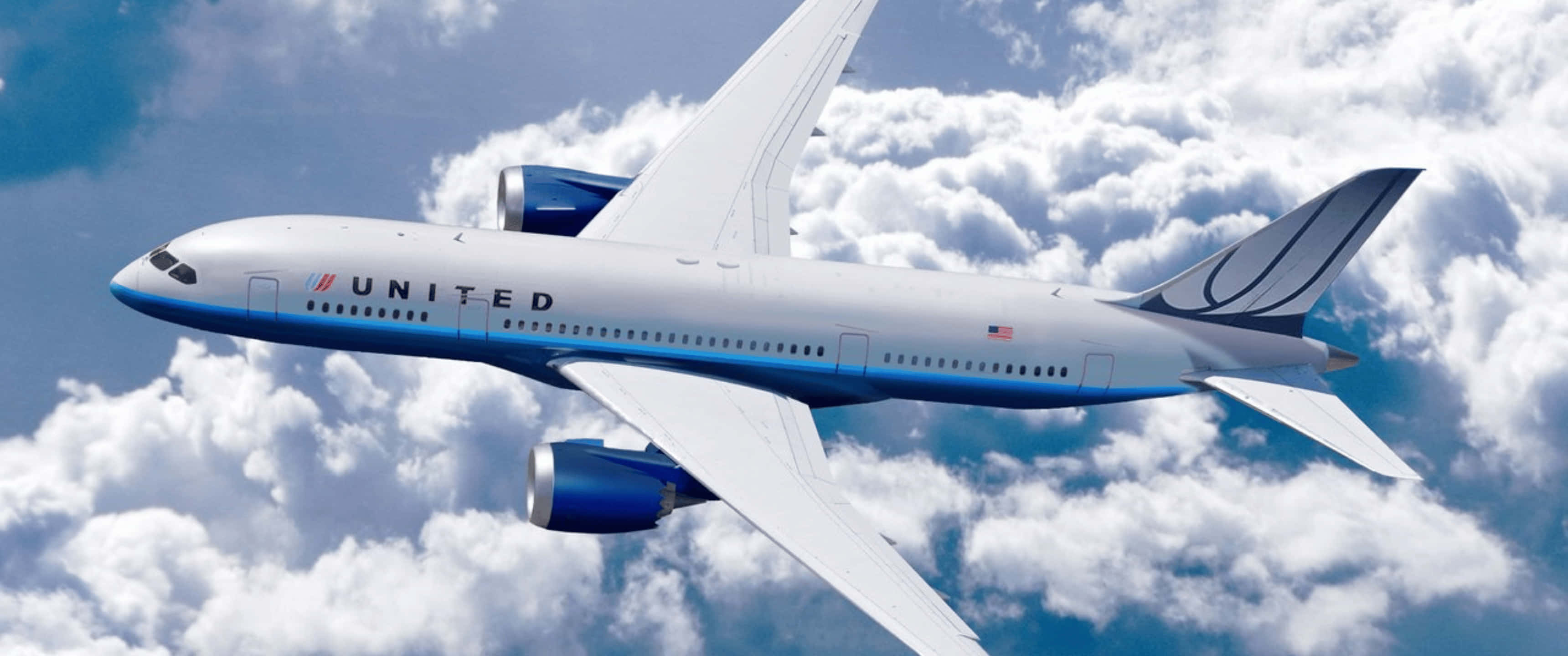 Plane 桌布 壁紙 — 聯合航空的波音787在湛藍的天空中優雅地翱翔於蓬鬆的白雲之上。
