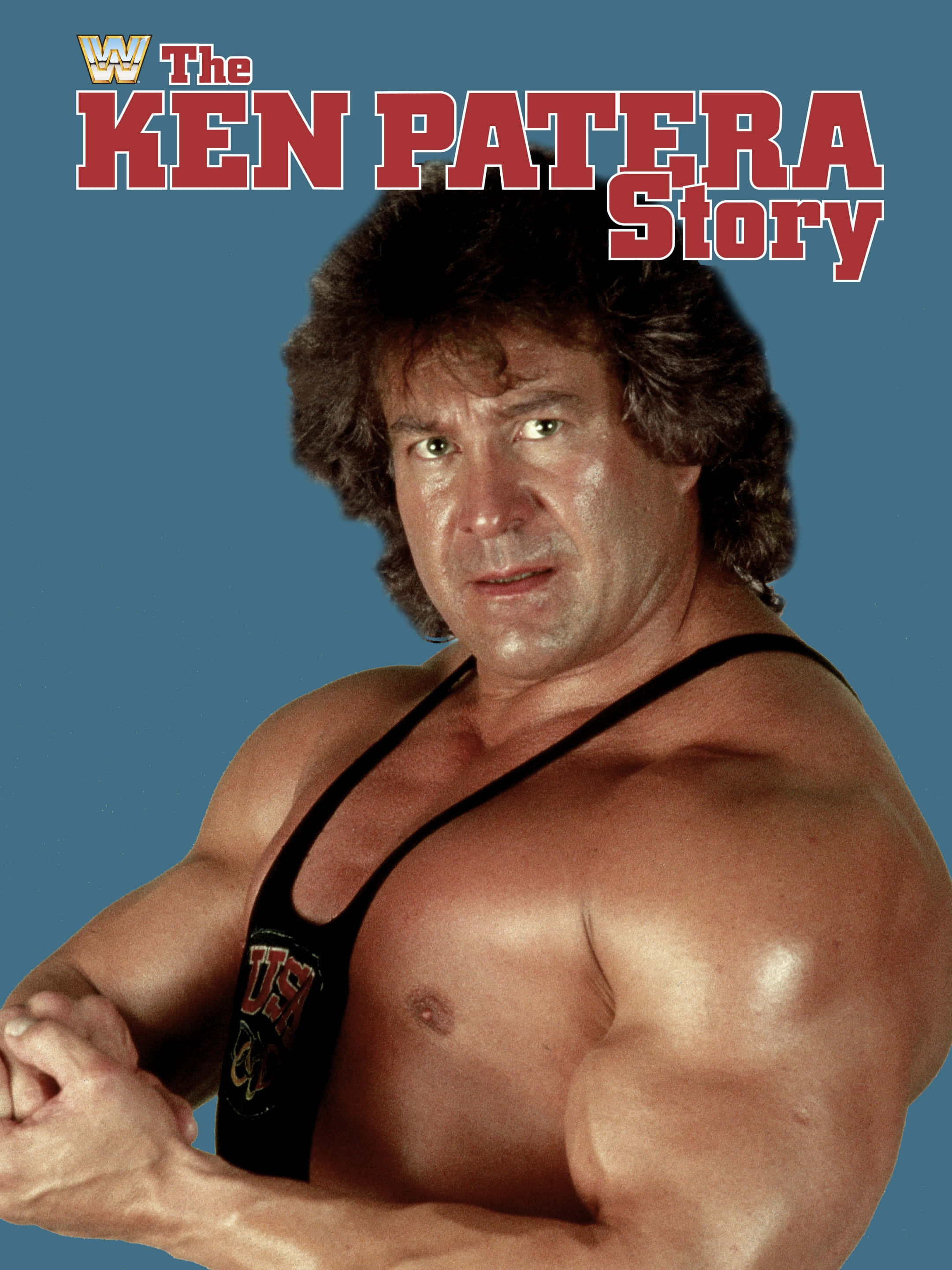 攝影 桌布 壁紙 — 肌肉發達的摔角手 Ken Patera 穿著黑色緊身衣，在純藍色背景上加上紅色文字疊加，凝視著鏡頭。