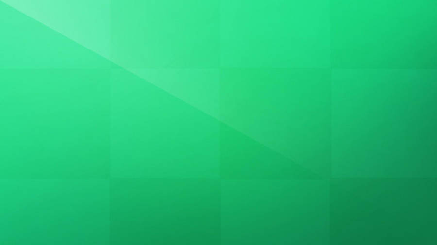 Light Green Plain 桌布 壁紙 — 舒緩的漸變綠色抽象背景，帶有柔和的幾何陰影和微妙的對角光線點綴。