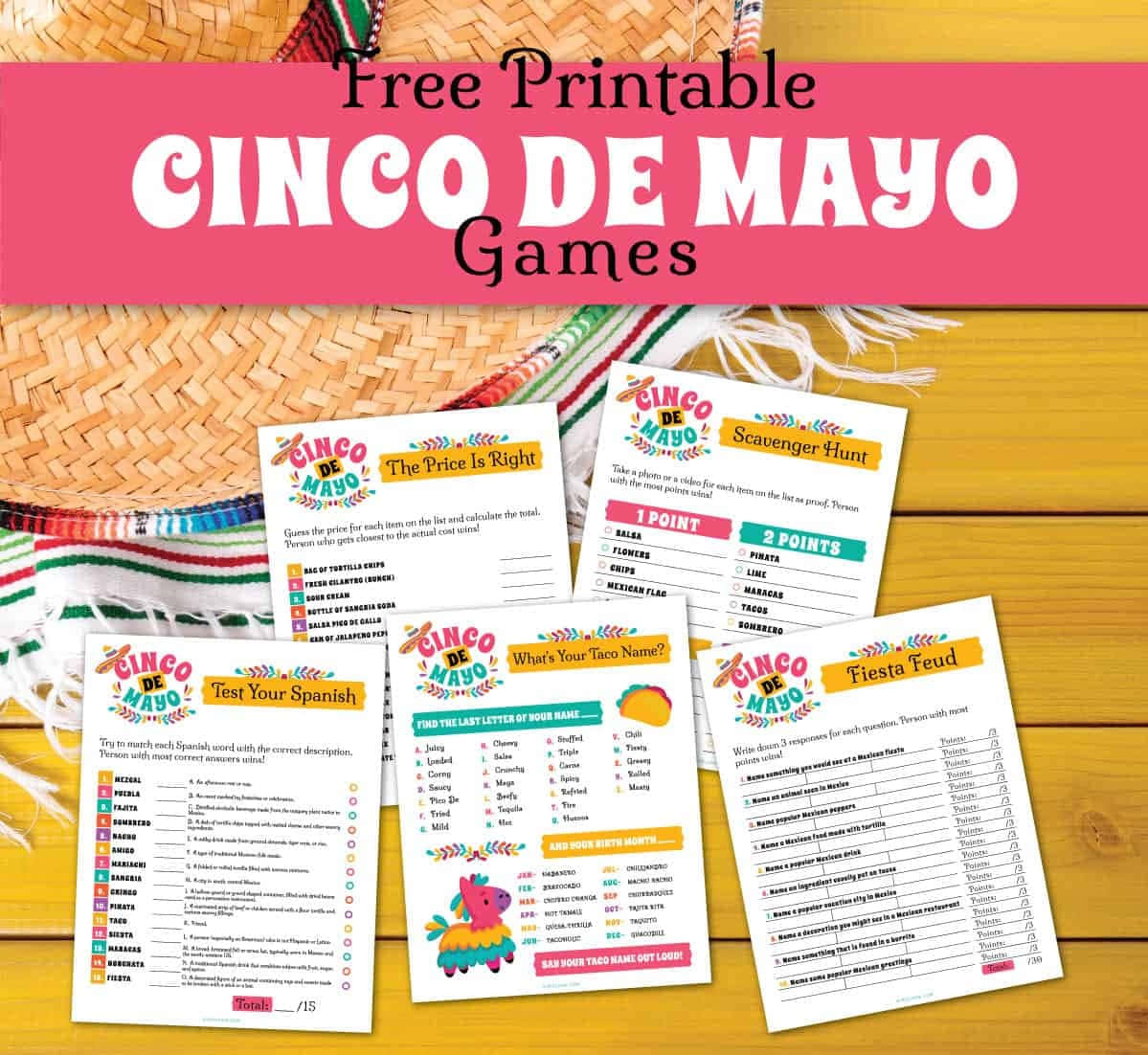 Cinco De Mayo 桌布 壁紙 — 色彩繽紛的 Cinco de Mayo 遊戲印刷品散佈在木桌上，旁邊放著一頂帶有節日流蘇的編織墨西哥闊邊帽。