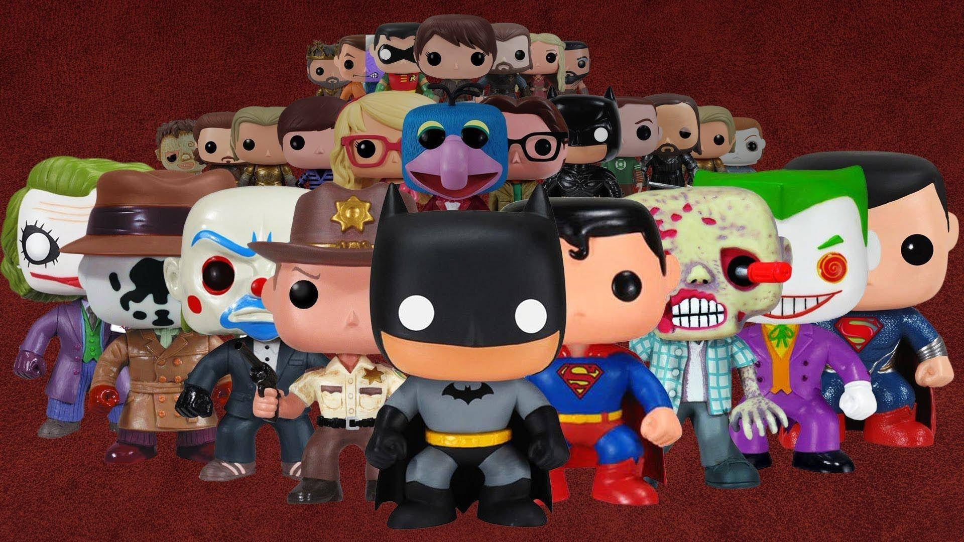 pop 桌布 壁紙 — 色彩繽紛的Funko Pop！乙烯基公仔系列，包括蝙蝠俠、超人及各種反派，在深紅色背景下擺出姿勢。