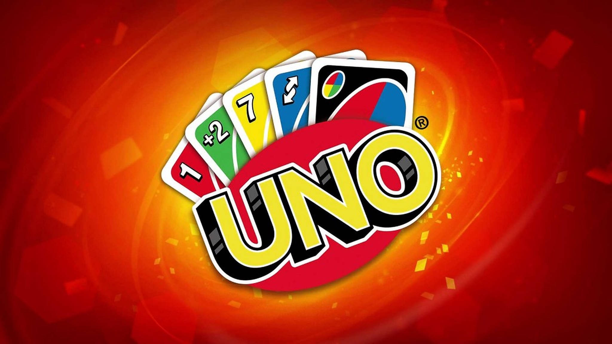 Uno 桌布 壁紙 — 色彩繽紛的UNO標誌，彩色卡牌呈扇形展開，背景是旋轉的紅橙色並帶有發光粒子。