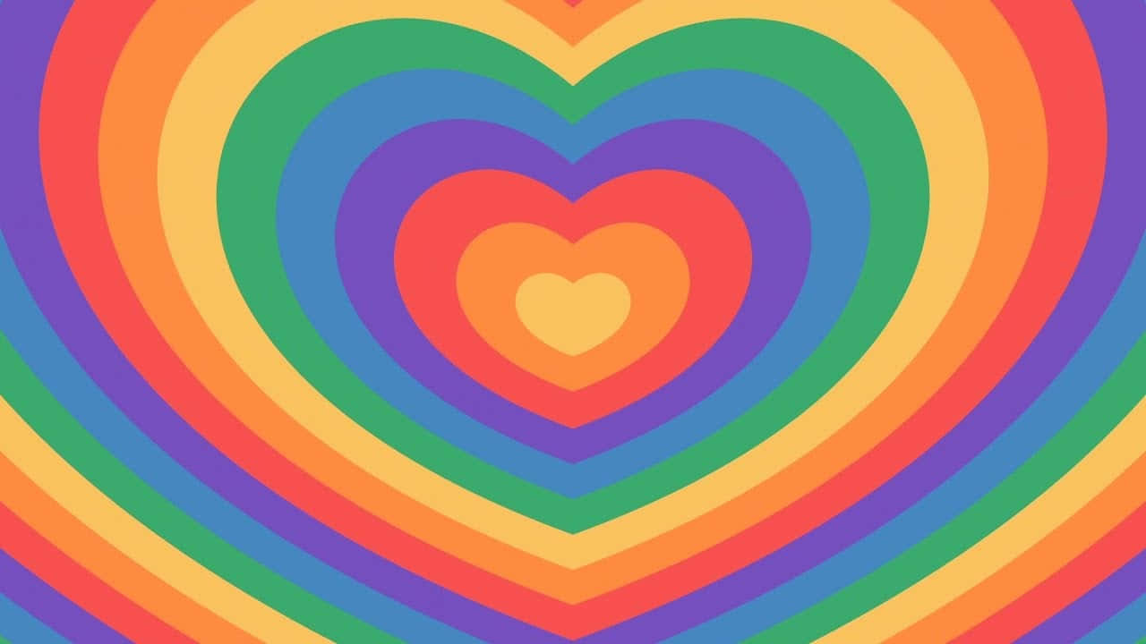 Heart Tunnel 桌布 壁紙 — 色彩繽紛的同心愛心從中央的黃色愛心向外放射，呈現彩虹色調。