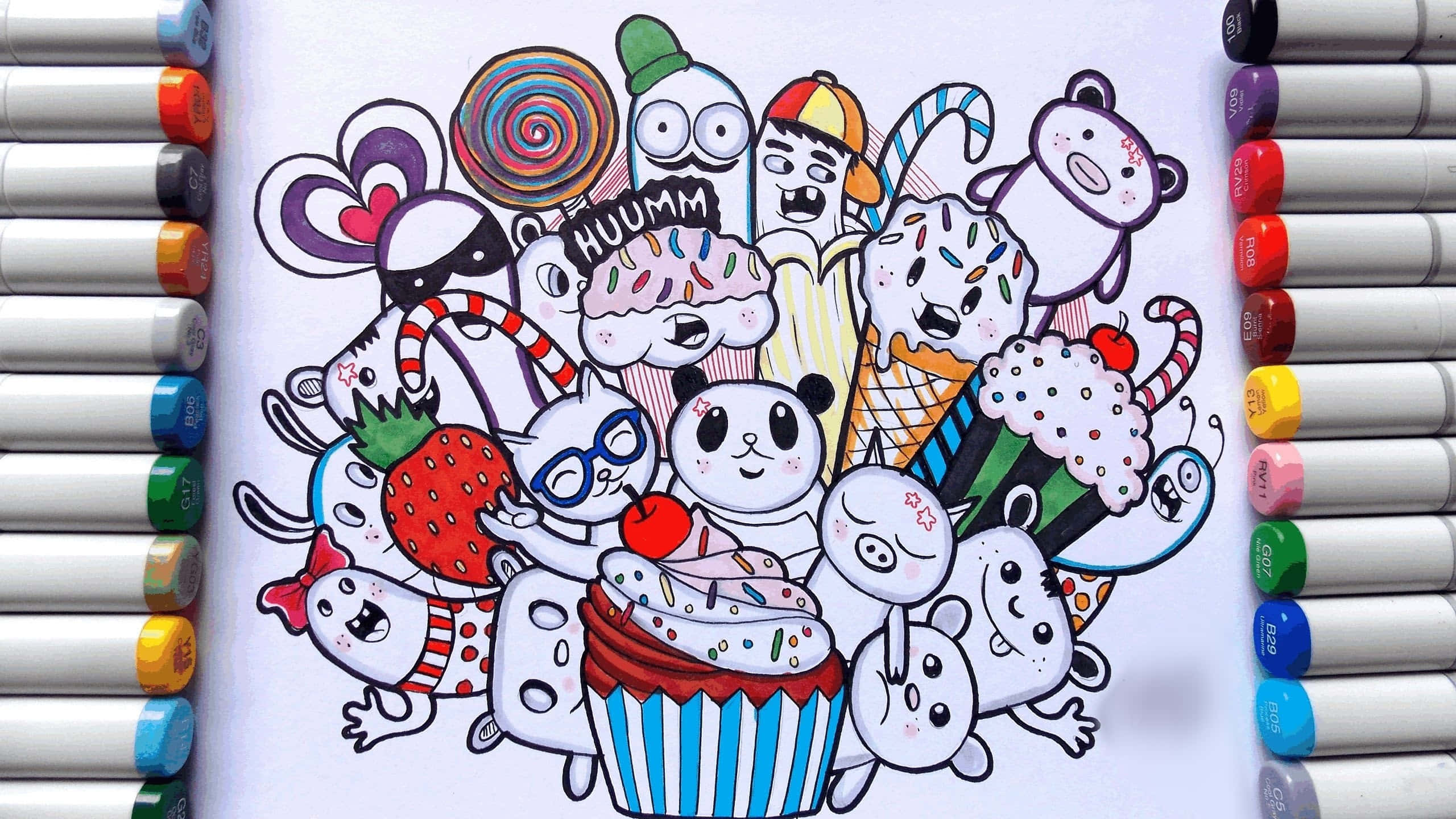 塗鴉動圖 桌布 壁紙 — 色彩繽紛的塗鴉，描繪卡通角色和糖果從杯子蛋糕中迸出，並以彩色馬克筆框住。