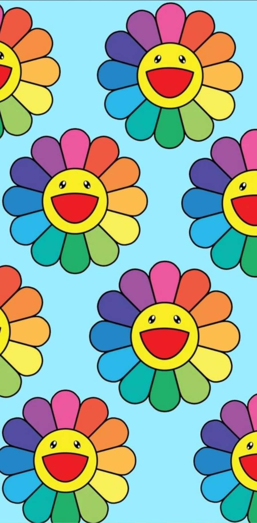 Aesthetic Smiley Face 桌布 壁紙 — 色彩繽紛的彩虹色微笑花朵，帶有黃色笑臉，在淺藍色背景上重複排列。