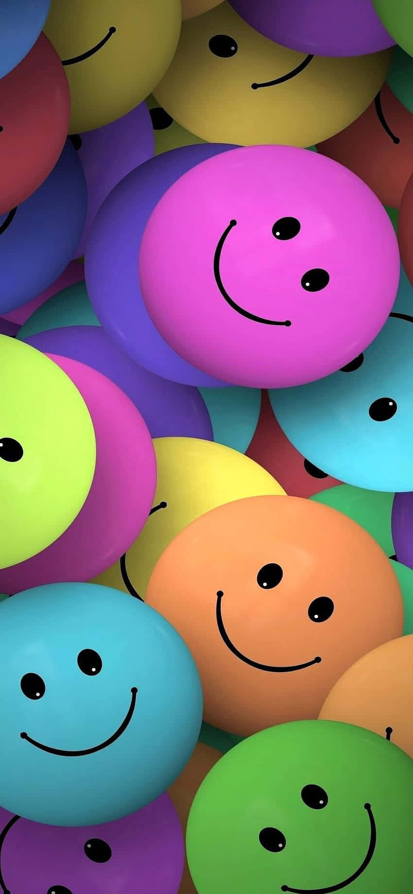 cute happy 桌布 壁紙 — 色彩繽紛的球體帶有簡單笑臉堆疊在一起的鮮明特寫。