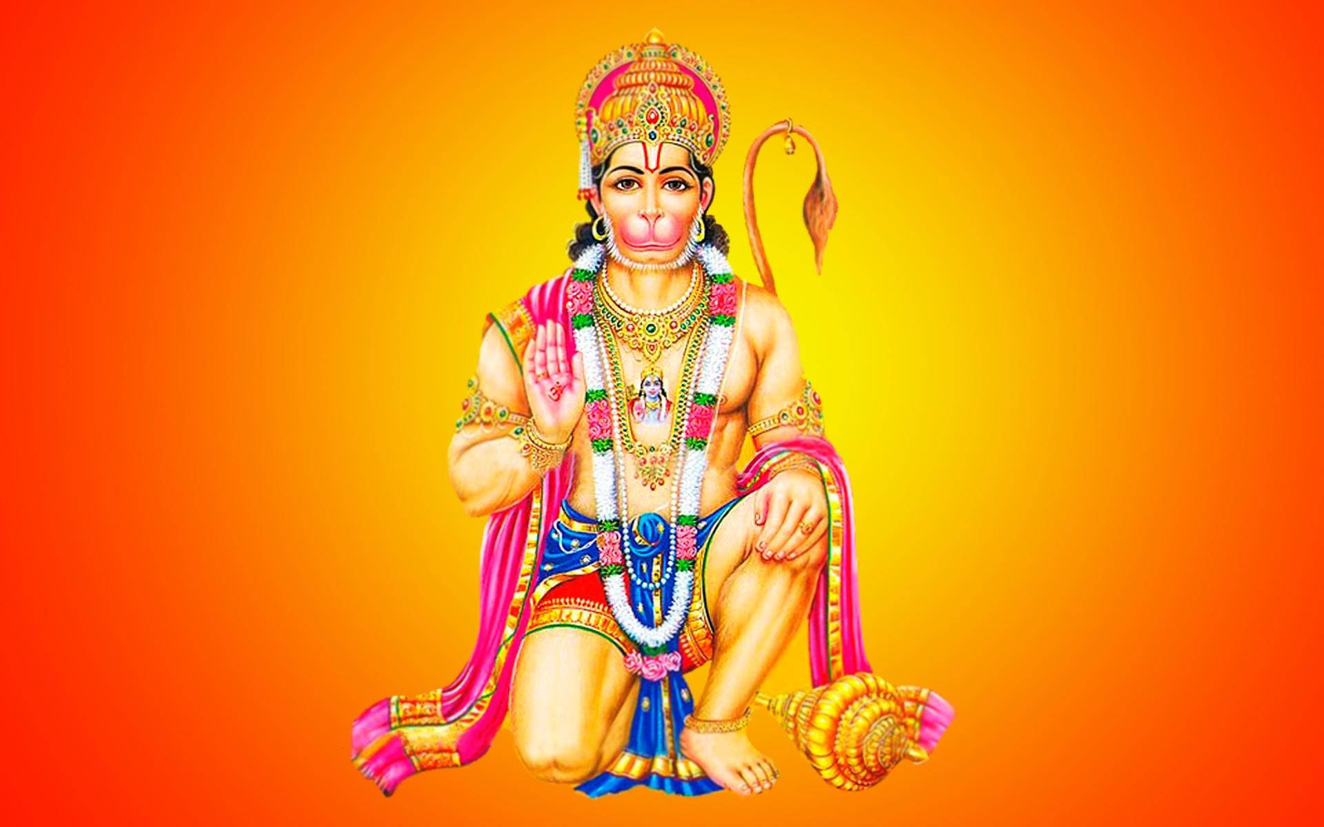 lord hanuman 桌布 壁紙 — 色彩鮮明的印度教神祇哈努曼，身穿華麗的金色和粉紅色服飾，優雅地坐在耀眼的橙黃漸變背景前。