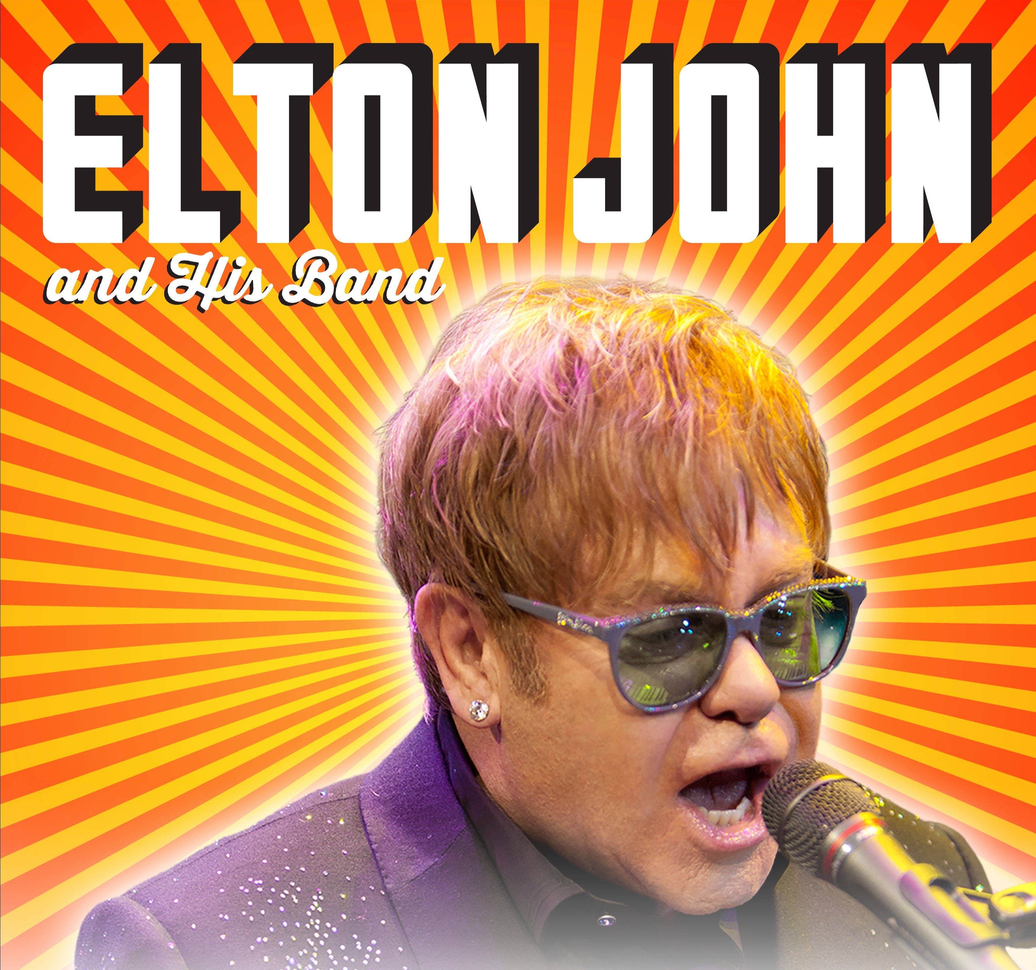 Elton John 桌布 壁紙 — 艾爾頓·約翰戴著閃閃發光的太陽眼鏡，在充滿活力的橙黃色太陽光線背景下對著麥克風唱歌。