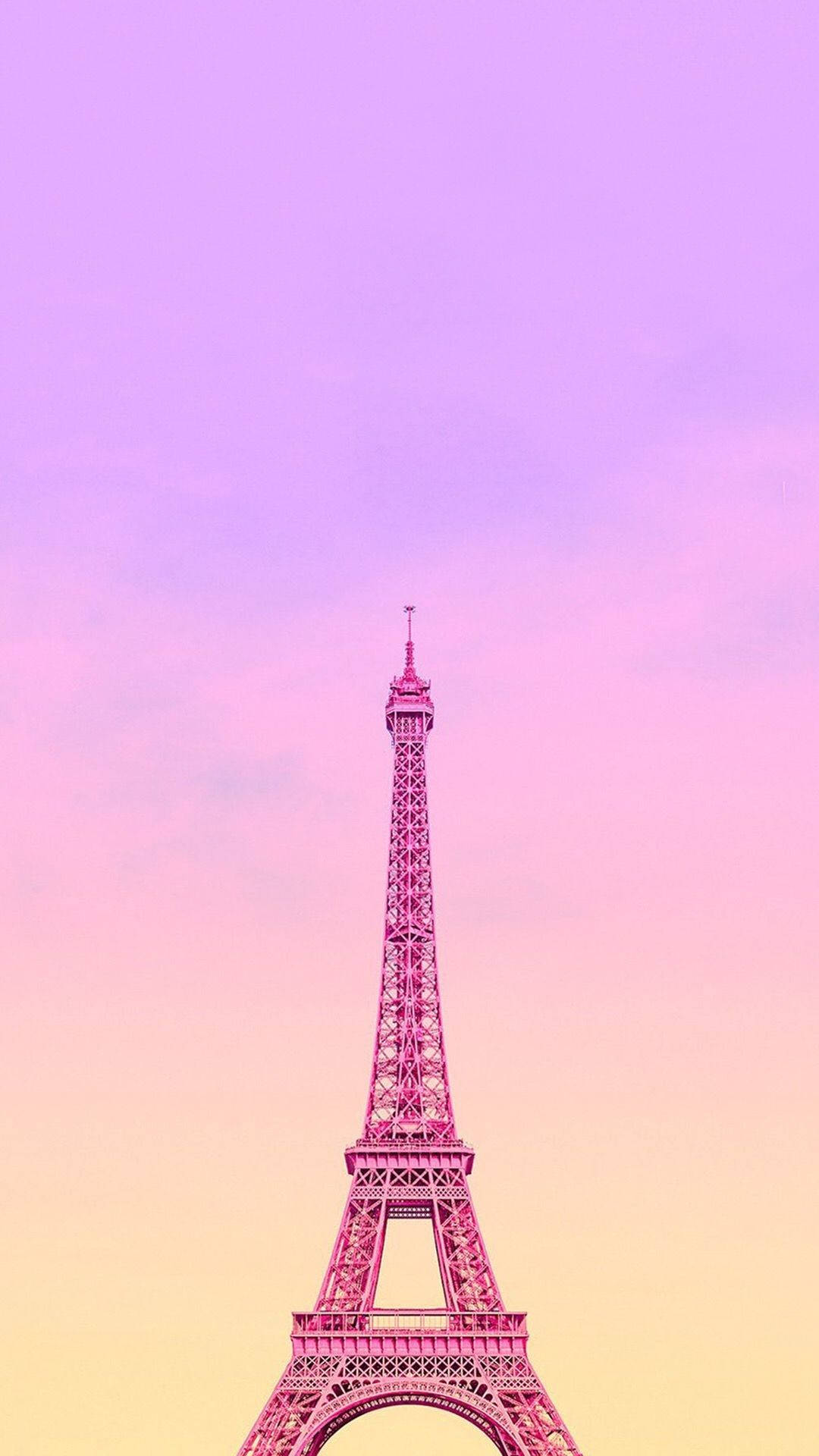 Eiffel Tower 桌布 壁紙 — 艾菲爾鐵塔在粉紅、紫色和黃色的夢幻漸變天空下高聳入雲。