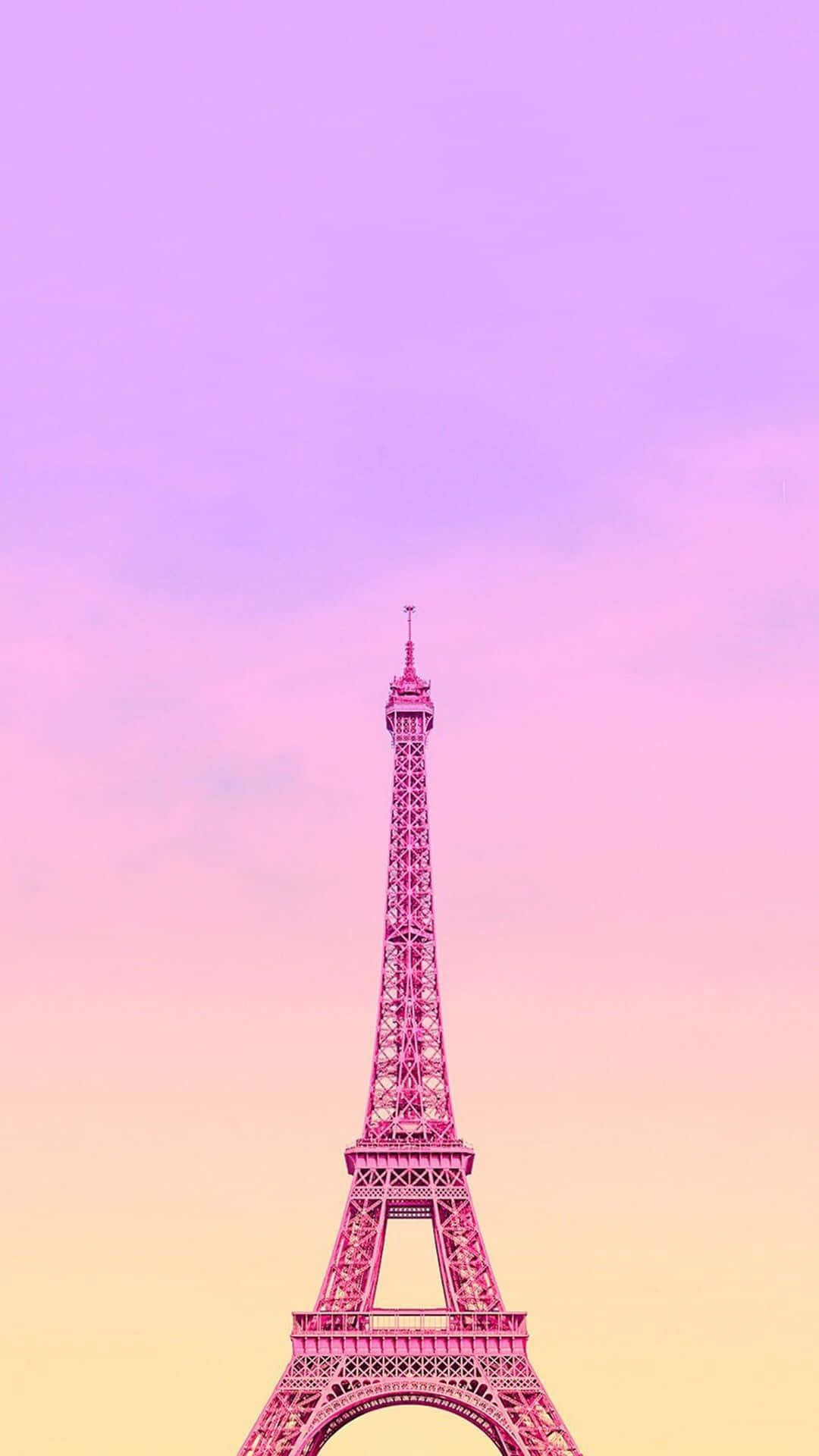 Eiffel Tower 桌布 壁紙 — 艾菲爾鐵塔高聳入雲，背景是夢幻般的粉紅、紫色和黃色漸變天空。