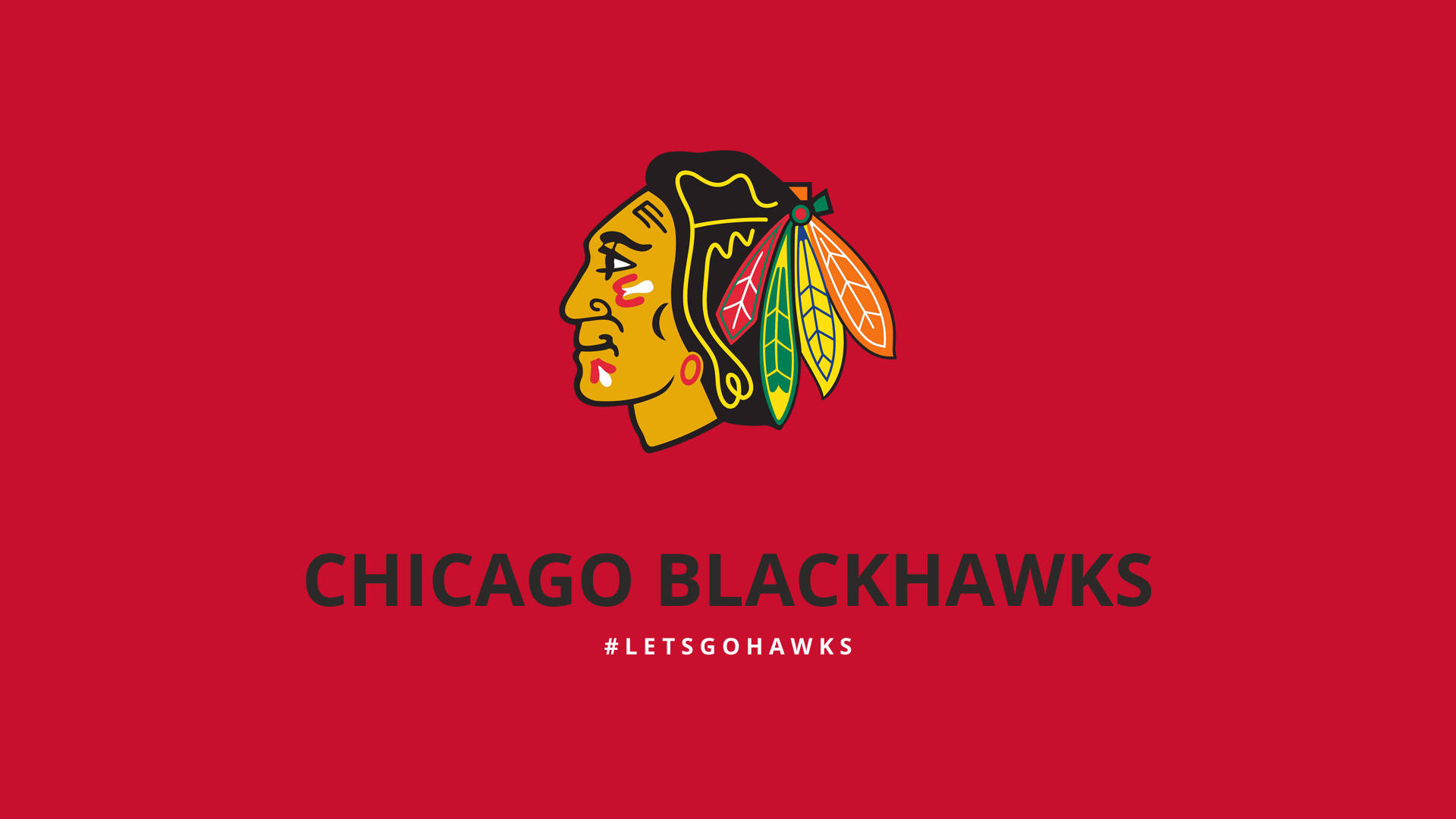 Blackhawks 桌布 壁紙 — 芝加哥黑鷹隊標誌以鮮明色彩居中顯示在純紅色背景上，下方有球隊名稱和主題標籤。