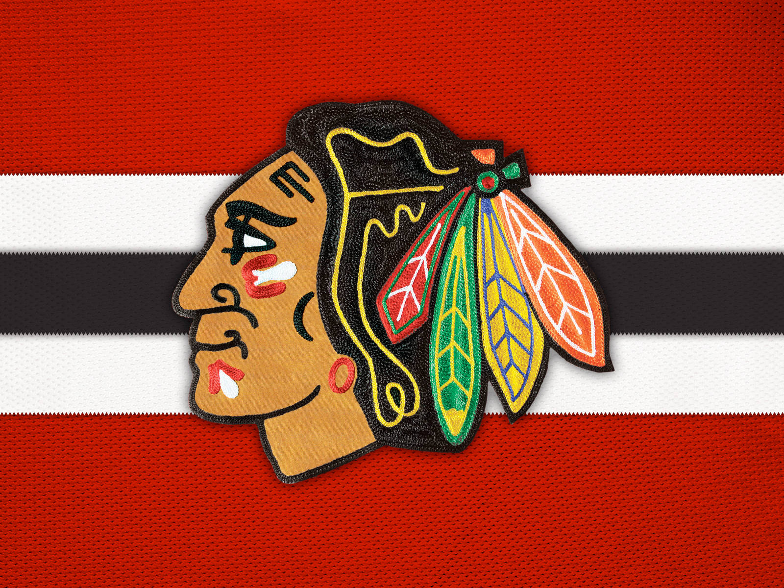 Blackhawks 桌布 壁紙 — 芝加哥黑鷹隊標誌刺繡在紅白黑條紋布料背景上。