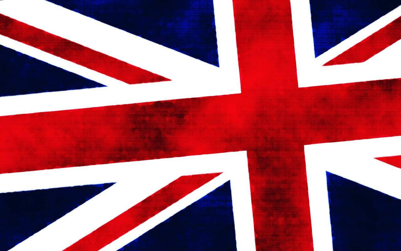 United Kingdom Flag 桌布 壁紙 — 英國國旗的紋理特寫，帶有鮮明的紅、白和海軍藍色。