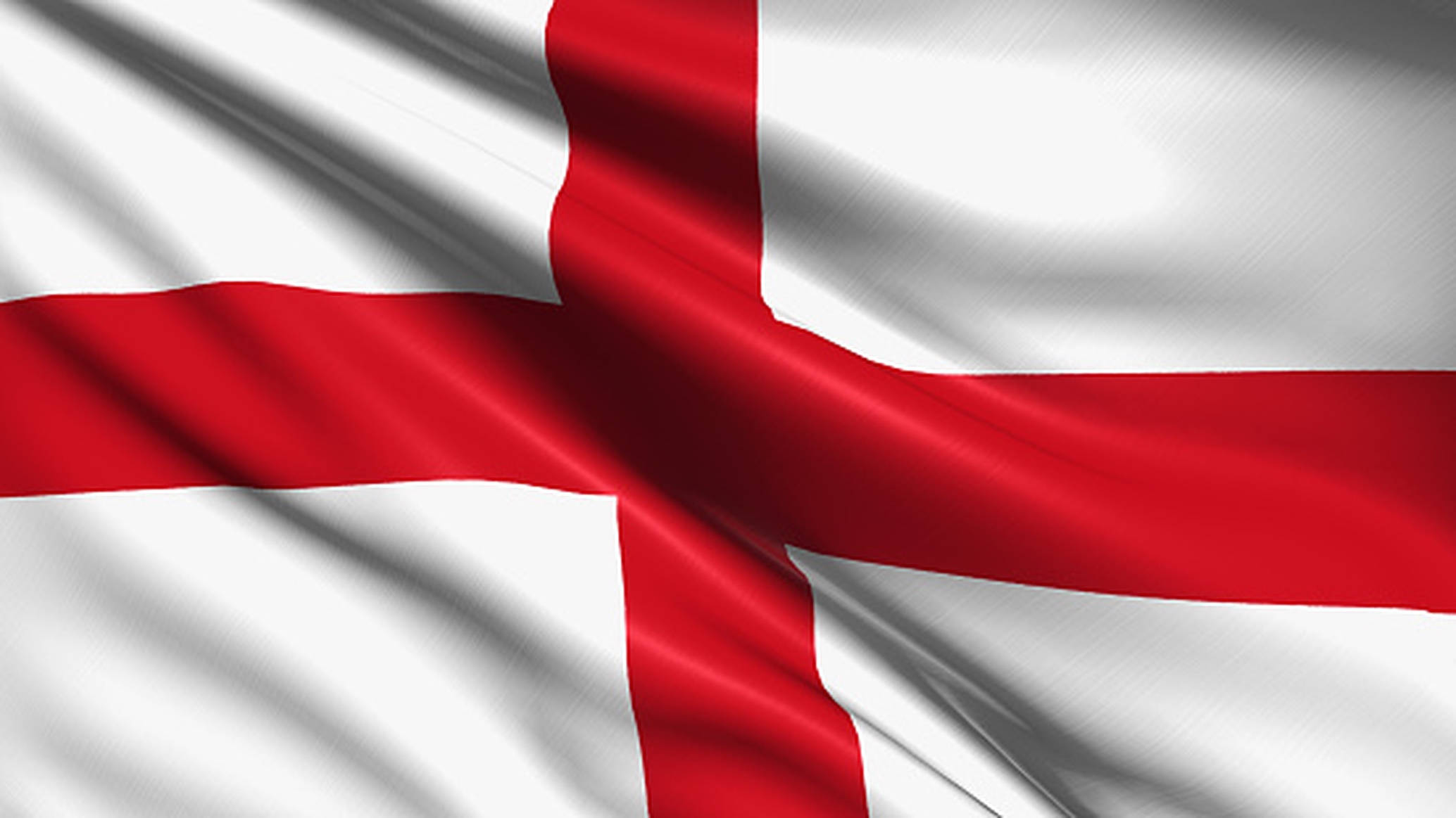 England Flag 桌布 壁紙 — 英格蘭旗幟上帶有醒目的紅色十字，白色布料在風中動態飄揚。