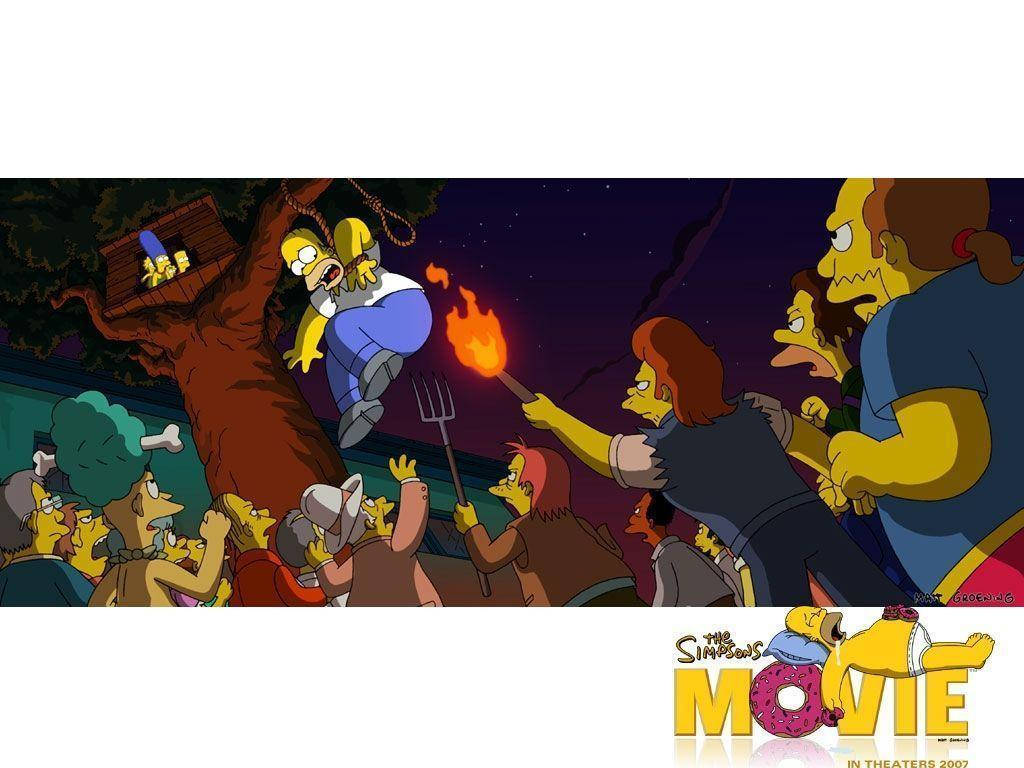homer 桌布 壁紙 — 荷馬·辛普森掛在樹上，村民們手持火把和乾草叉在星空下包圍他。