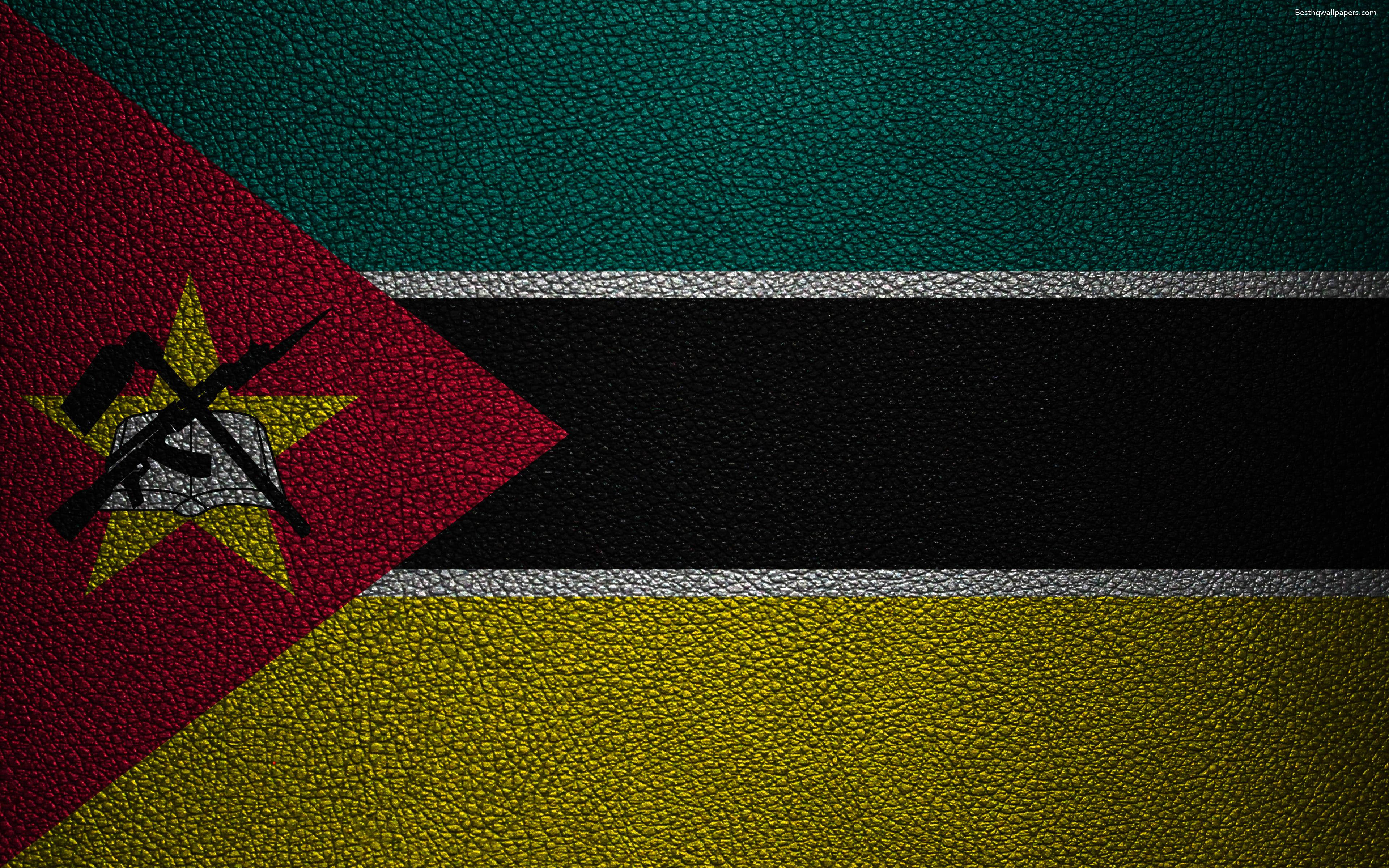 Mozambique 桌布 壁紙 — 莫三比克國旗呈現在有紋理的皮革上，帶有鮮明的紅、黃、綠條紋和中央徽章。