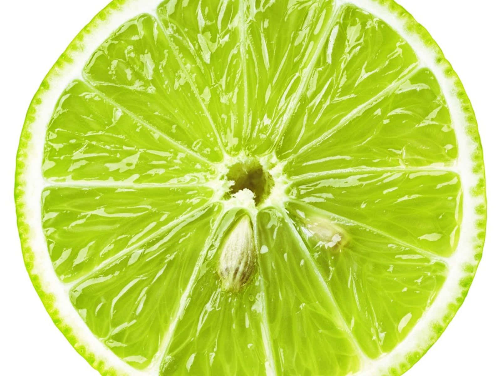 Lime 桌布 壁紙 — 萊姆的鮮明橫切面在純白背景下展現出多汁的果肉瓣和中央的種子。
