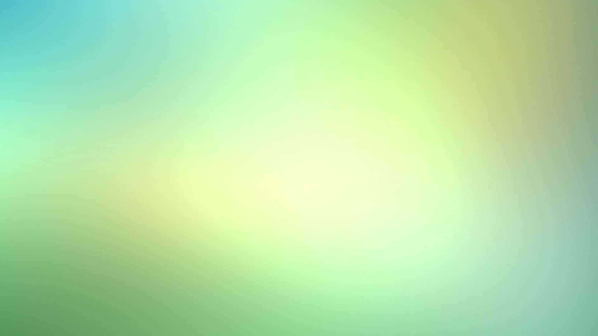 Light Color 桌布 壁紙 — 薄荷綠和淡黃色的柔和漸層從明亮的中心向外擴散，營造出平靜的抽象光芒。