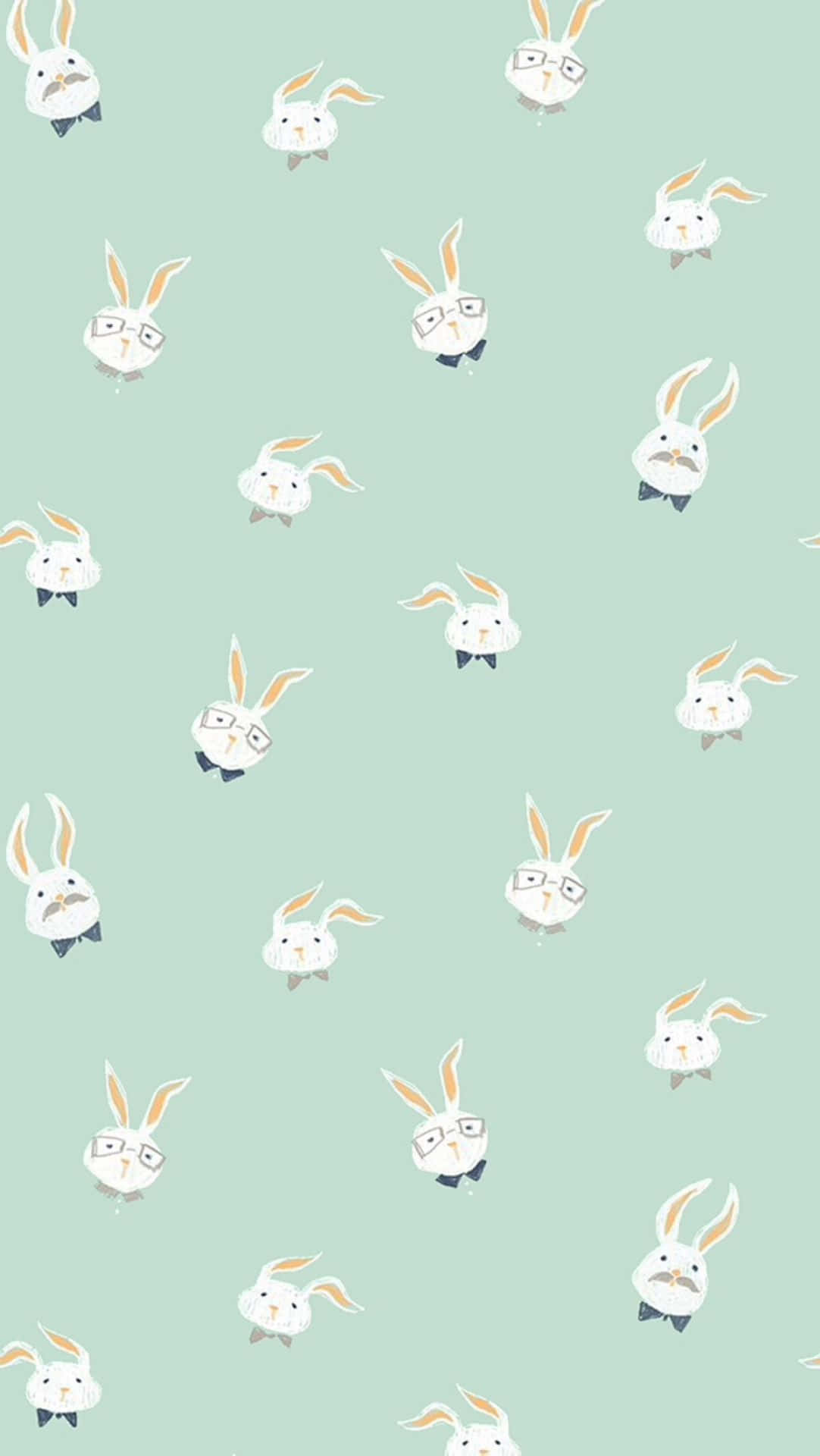 Cute Phone 桌布 壁紙 — 薄荷綠色壁紙，上面散落著戴眼鏡和蝴蝶結的可愛卡通兔子，形成有趣的重复圖案。